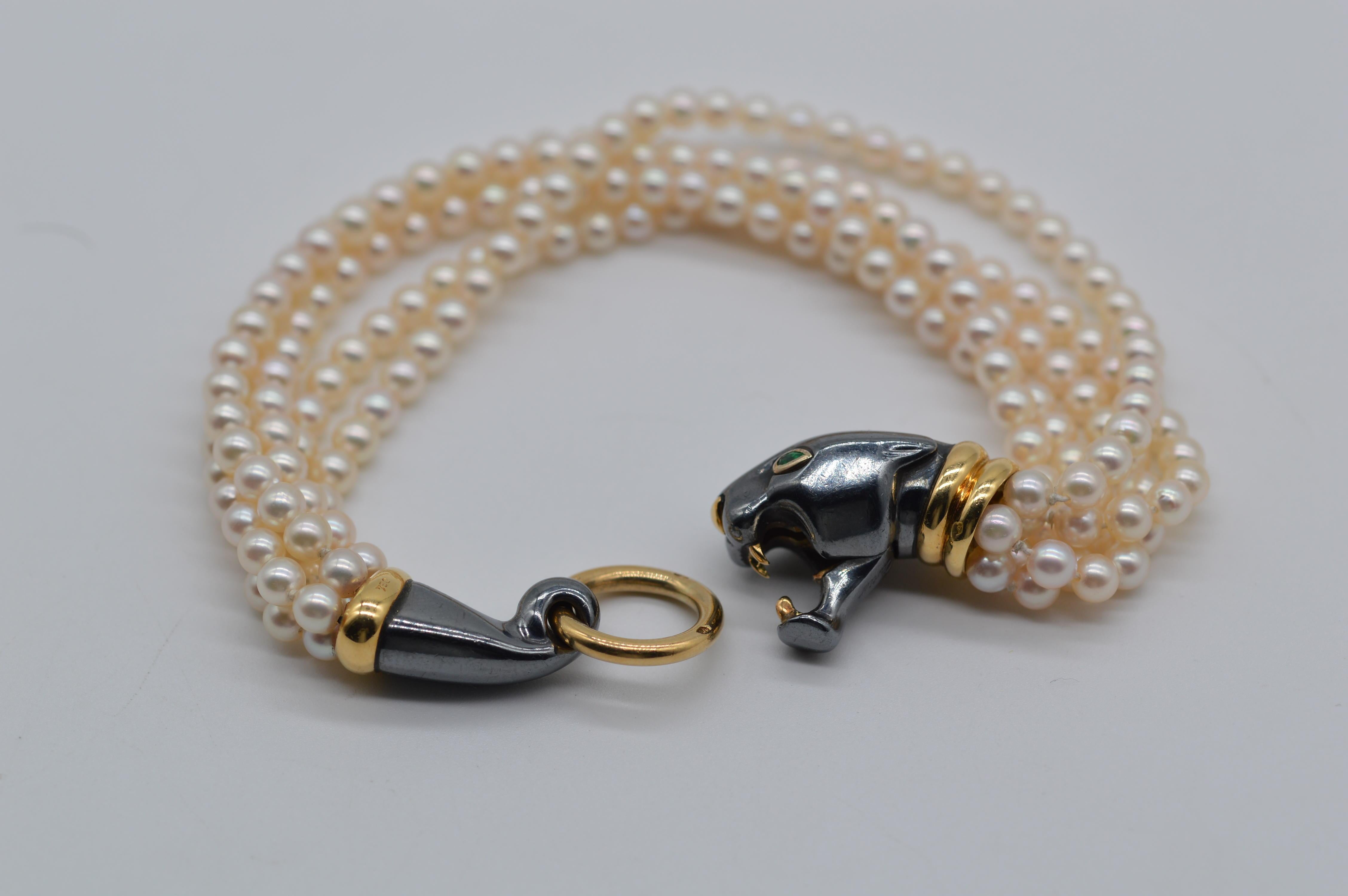 Cartier Panthère with Pearls Bracelet
18K Yellow Gold & Silver
5 Strands of Pearls & 2 Pearshape Emeralds Eyes
Weight is 35.3 grams
Akoya Japan Cultured Pearls
Vintage worn conditions
Approx. from early 2000's