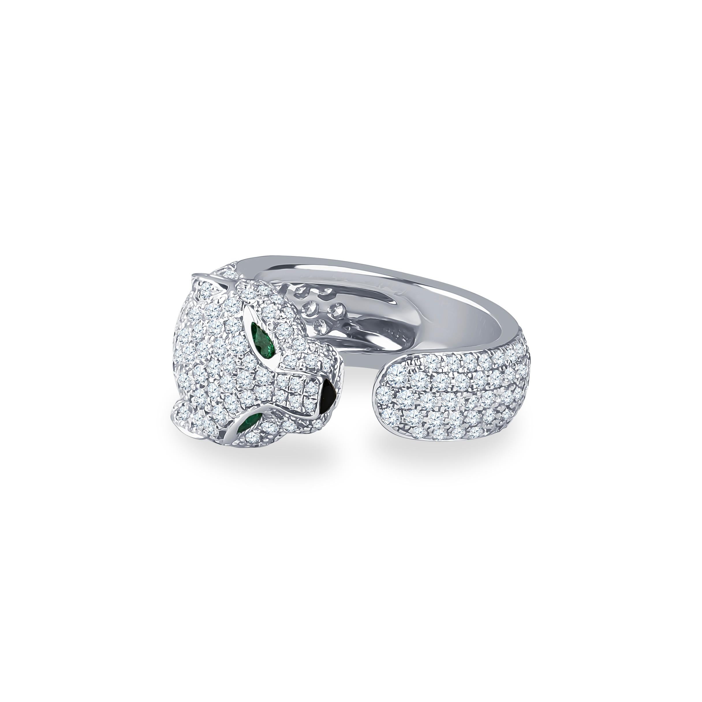 18K white gold, set with 285 diamonds totaling 2.39 carats, with emerald and onyx accents. Size 5.5 ring. The original box is included with purchase. The panther's head is 10mm in width and 6mm high; the tail of the ring is 6mm in width