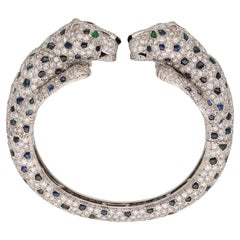 CARTIER Panthere Saphir, Onyx, Smaragd und Diamant-Armreif