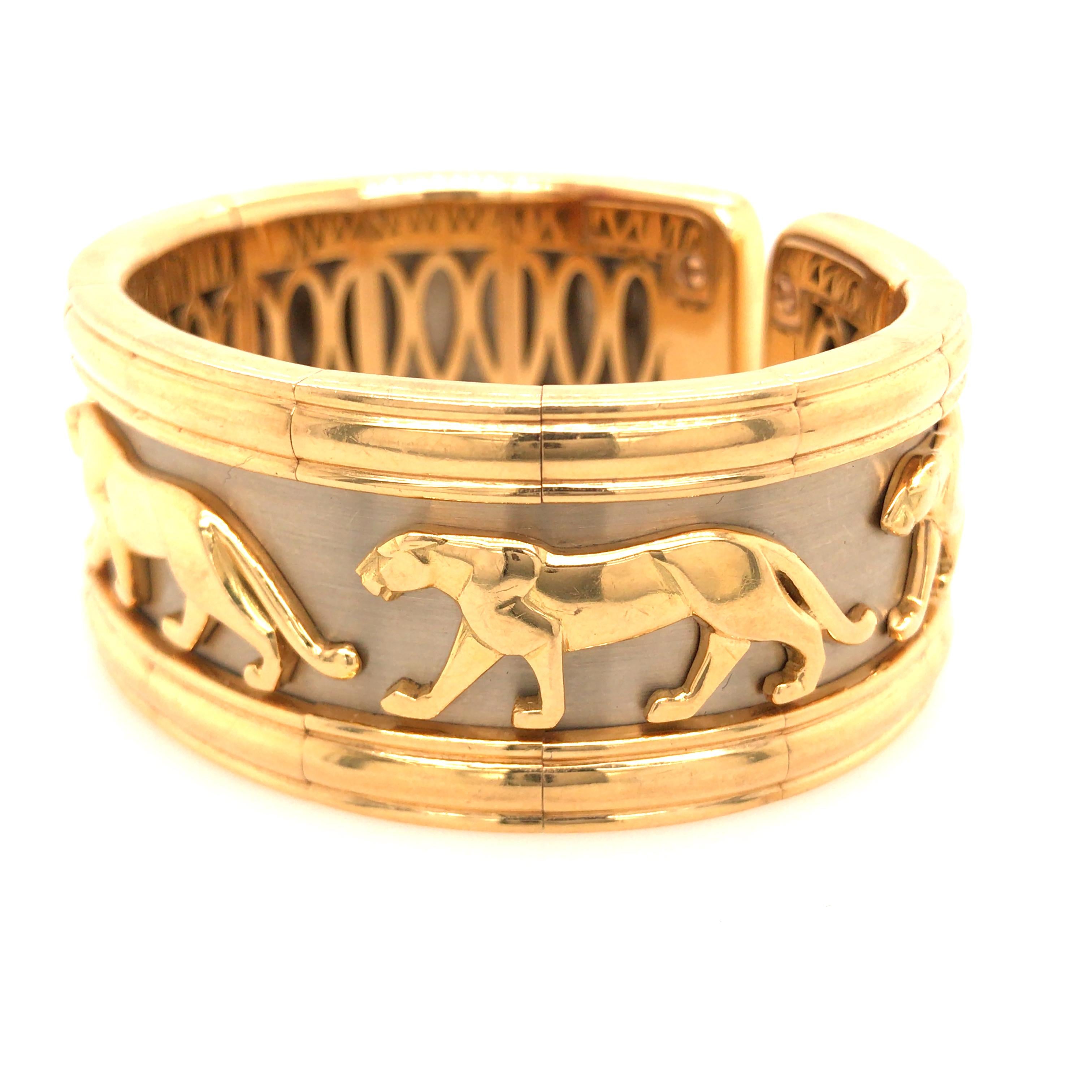 Cartier Panthère Torque 18K Two-Tone Gold Bangle Cuff Bracelet.  The Bracelet measures 1 inch in width and 6 inch in inner circumference.  108 grams.  Slightly flexible.  Signed, stamped 750 and serial number.