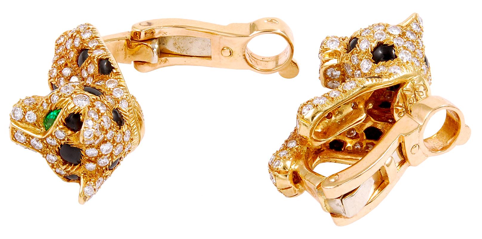 Cartier Panthere Vintage Diamond Pave Earrings in 18k Yellow Gold.
A pair of vintage mini Panthère de Cartier on-the-ear clips featuring their brilliant creature of 1970s design. White diamonds embedded in yellow gold starkly contrast emerald eyes