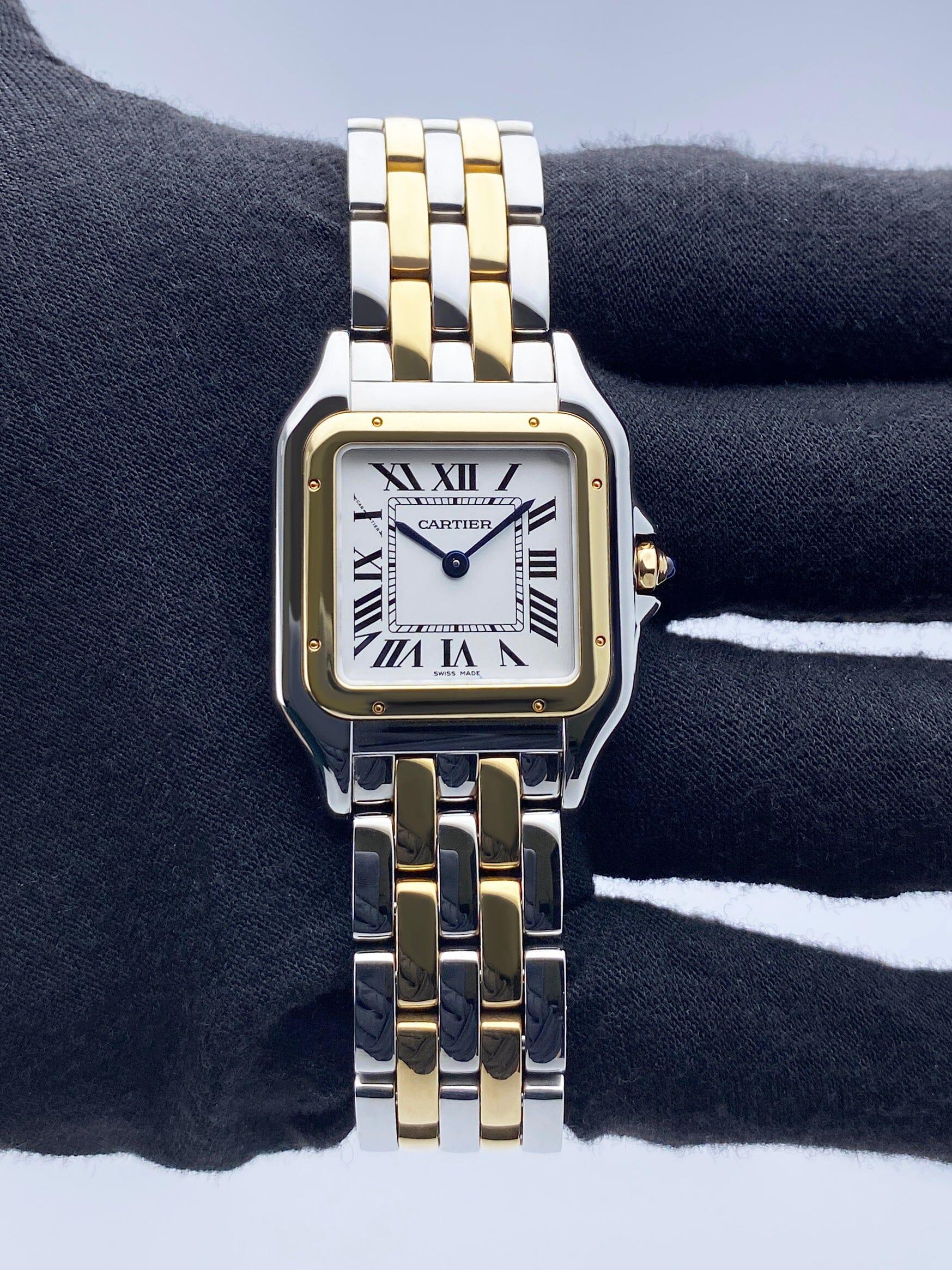 Cartier Panthere W2PN0007 / 4017 Ladies Watch. 27mm stainless steel case. 18K yellow gold smooth bezel. Silver dial with blue steel hands and Roman numeral hour markers. Minute markers on the inner dial. 18K yellow gold 
stainless steel