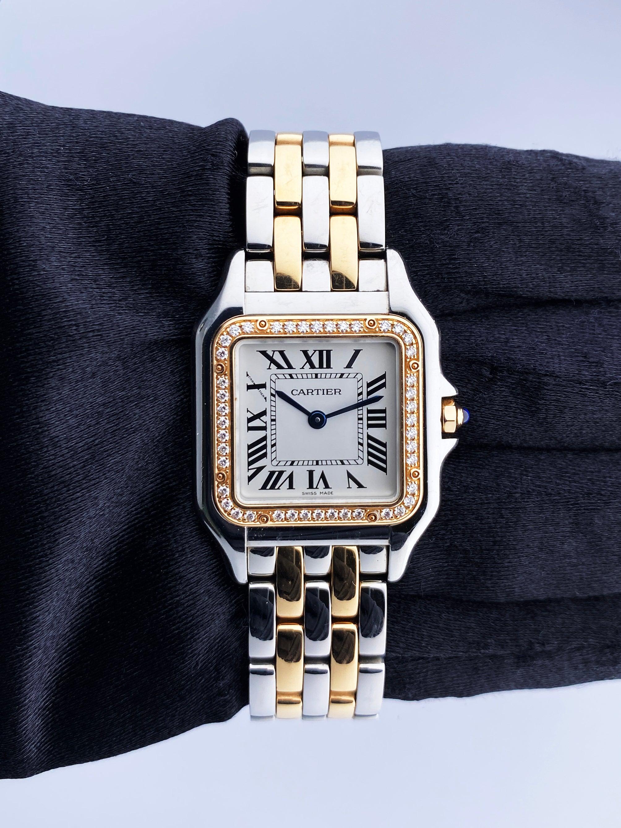 Cartier Panthere W3PN0007 Ladies Watch. 27mm stainless steel case. 18K rose gold with original factory diamond set bezel. Silver dial with blue steel hands and Roman numeral hour markers. Minute markers on the inner dial. 18K rose gold & stainless
