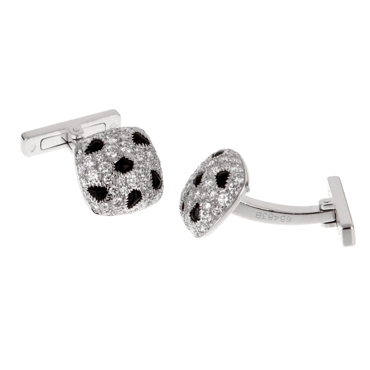 An iconic pair of Cartier Panthere cufflinks showcasing the finest Cartier round brilliant cut diamonds in shimmering 18k white gold with contrasting onyx.
