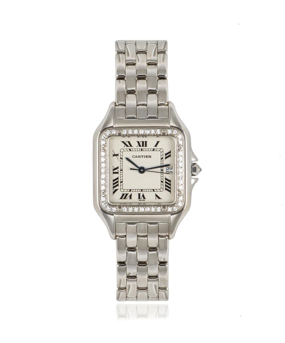 From Cartier's Panthere collection 27mm, this piece in white gold features a silver dial with Roman numerals, a date aperture, blued-steel sword-shaped hands and a secret Cartier signature at X.

The bezel is set with 44 round brilliant cut diamonds