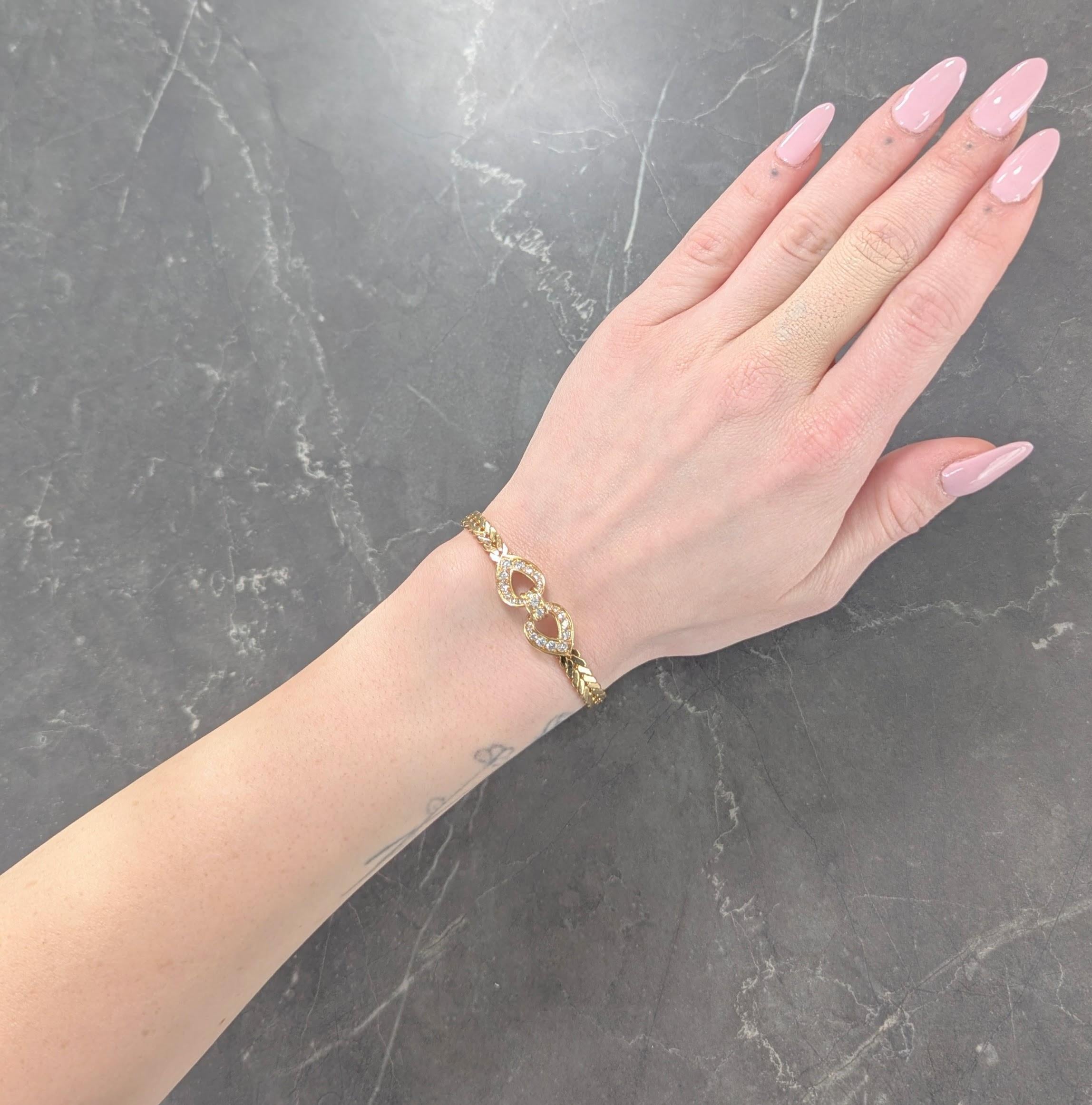 Comprised of wheat style chain featuring two looped stations
Bead set with round brilliant cut diamonds throughout
Weighing approximately 1.78 carats total
D/F color with VVS/VS1 clarity
Completed by fold over clasp
Stamped with French hallmarks for