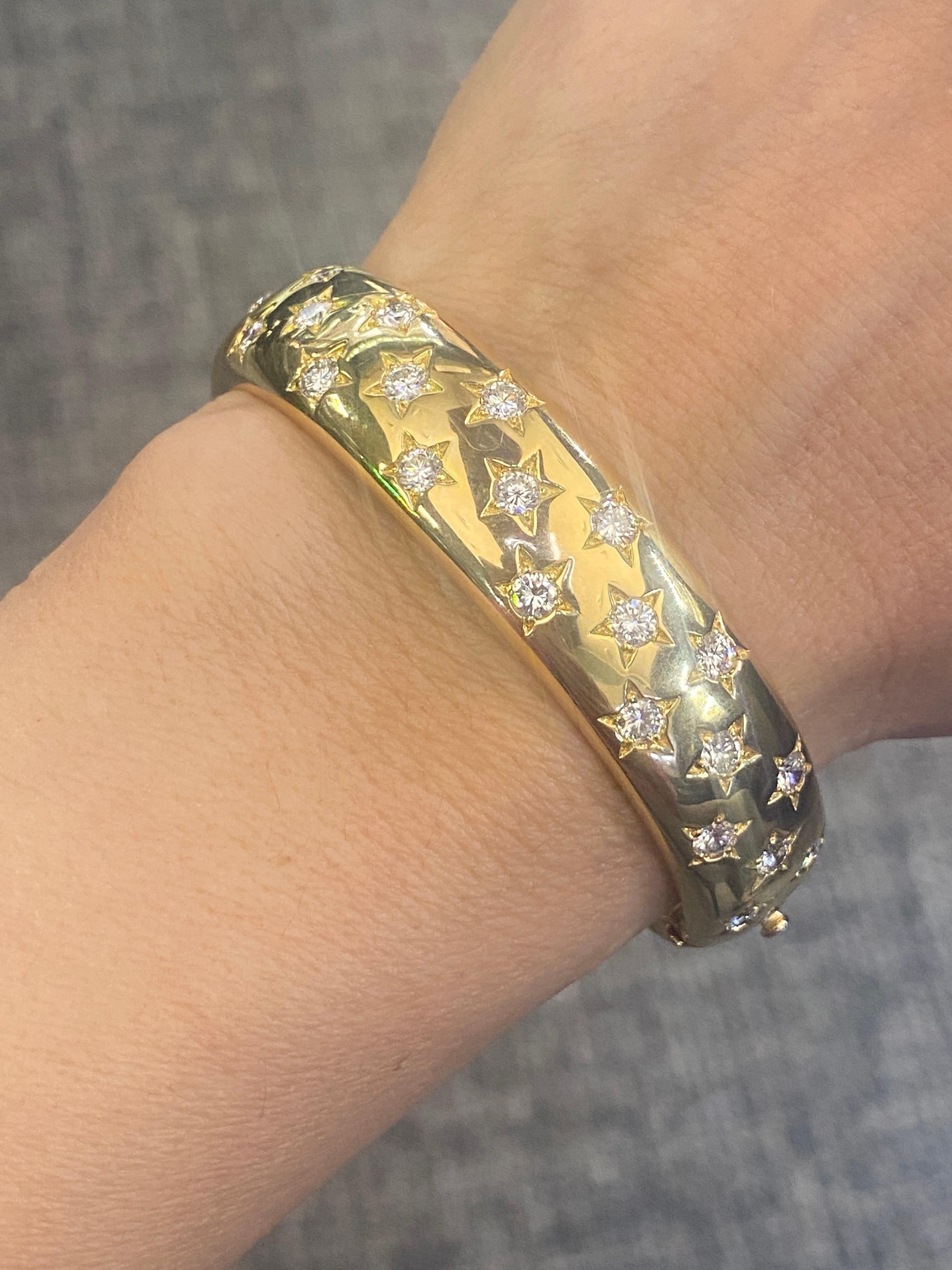 This striking 18k gold Cartier bangle is studded with approximately 6 1/2 carats of round cut diamonds. The circumference of the bangle measures 17cm. It is a delightful piece. 