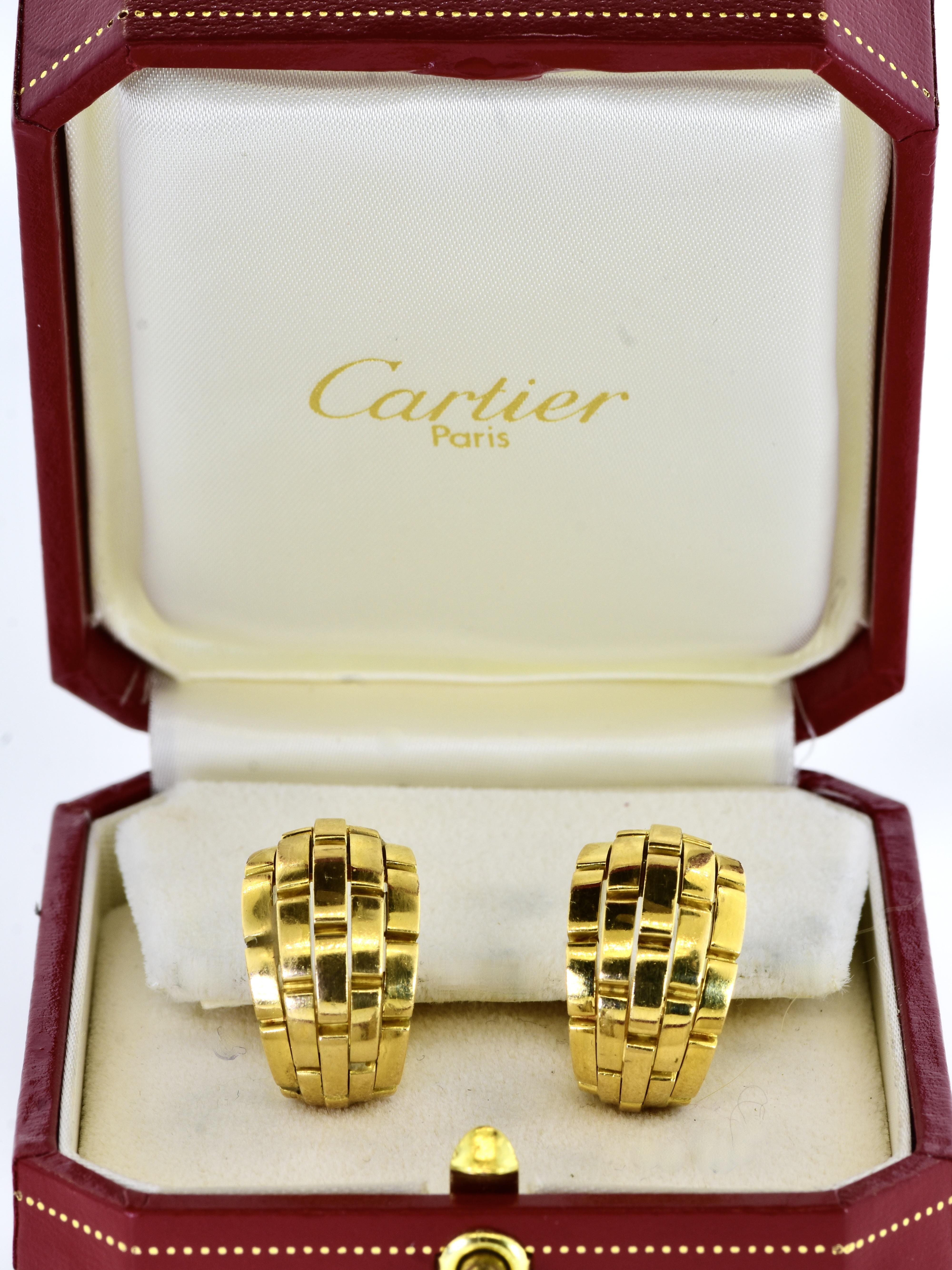 18K yellow gold earrings by Cartier, Paris. These earrings are from their Maillon de Panthere Collection. These classic Cartier earrings are the larger size with five rows. They measure 7/8
