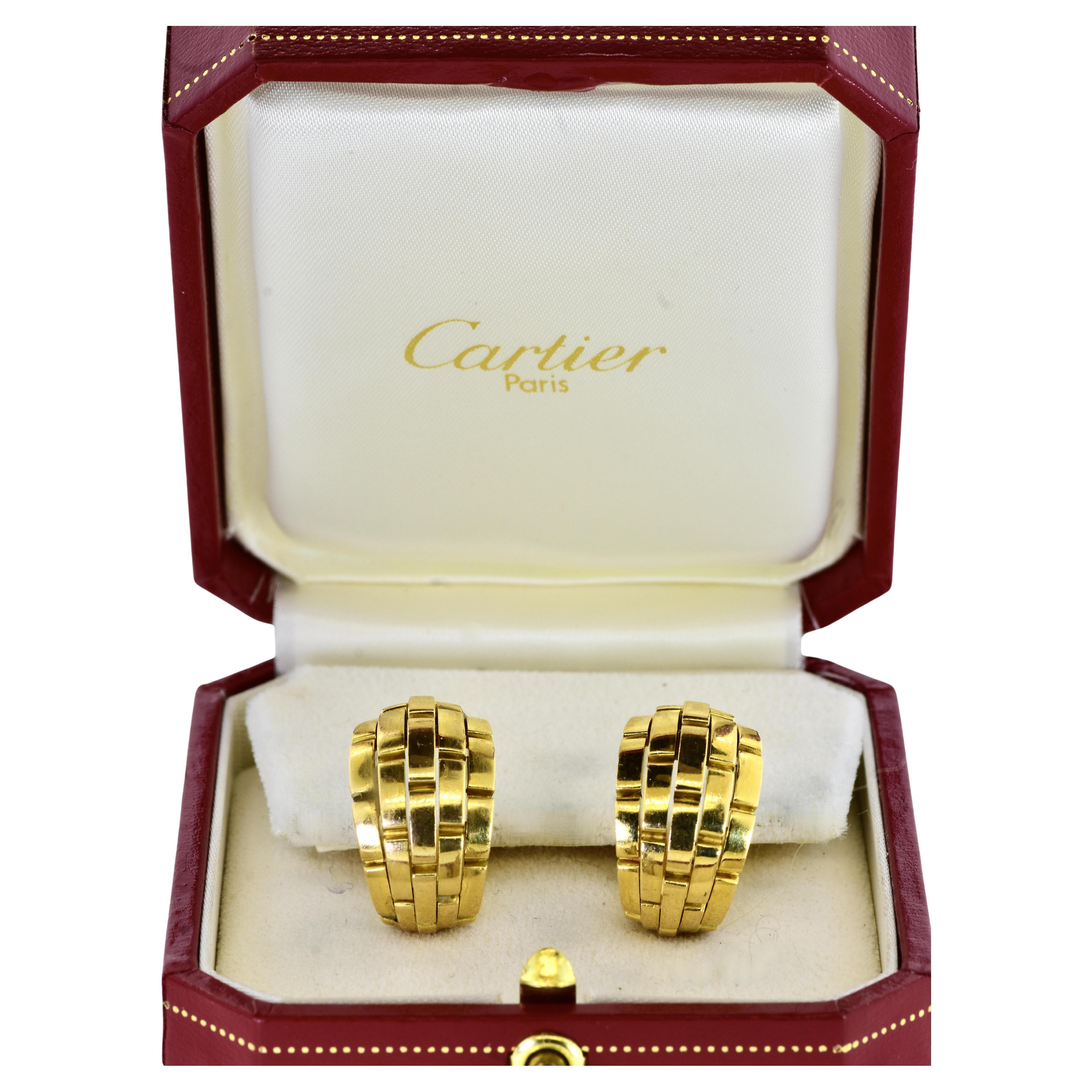 18K yellow gold earrings by Cartier, Paris. These earrings are from their Maillon de Panthere Collection. These classic Cartier earrings are the larger size with five rows. They measure 7/8