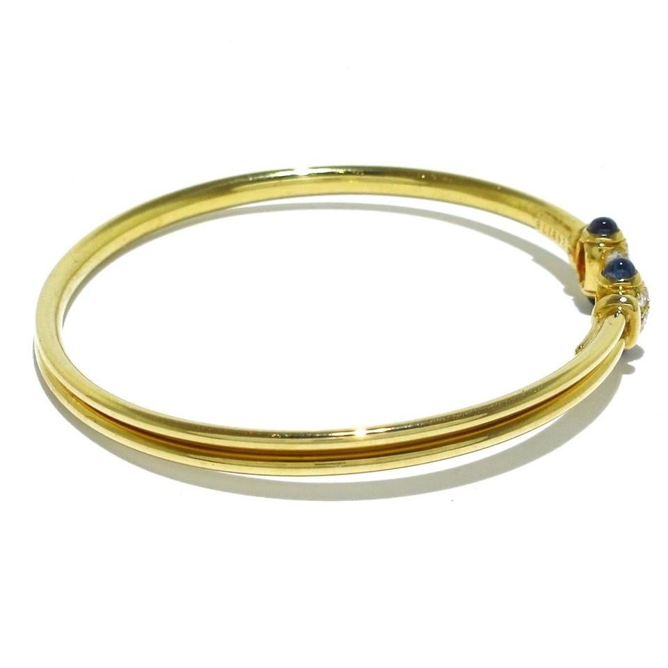 Cartier Paris 18K Yellow Gold, Cabochon Sapphire & Diamond Bangle Bracelet Circa 1980s Vintage
Here is your chance to purchase a beautiful and highly collectible designer bangle bracelet.  

Description: Offering a vintage Cartier Paris 18K Yellow
