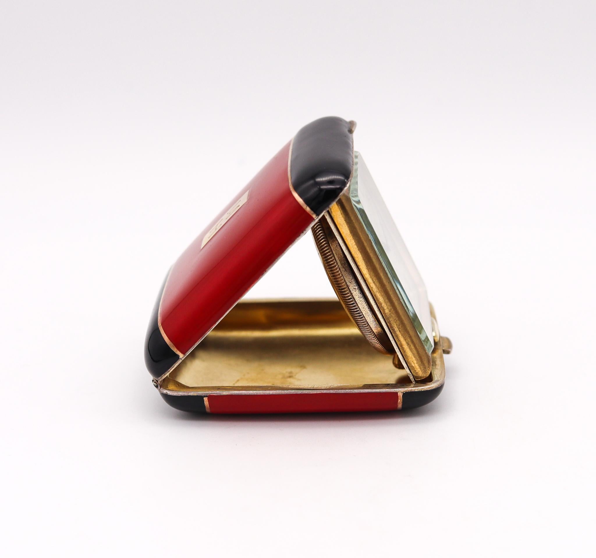 A travel clock designed by Cartier.

Very unusual and fine folded travel clock, created by the house of Cartier during the art deco period, back in the 1935. Crafted in gilded vermeil over sterling silver and embellished with applications of vivid