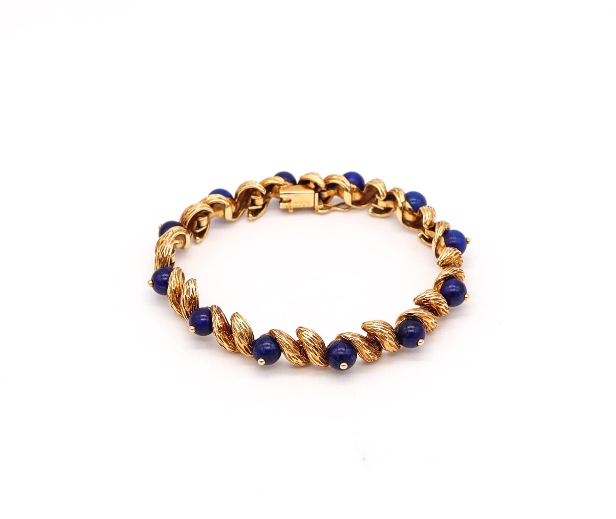 Retro bracelet designed by Cartier.

Beautiful rare bracelet, created in Paris France by the house of Cartier during the postwar period, back in the 1950's. This flexible bracelet has been crafted in solid yellow gold of 18 karats with textured