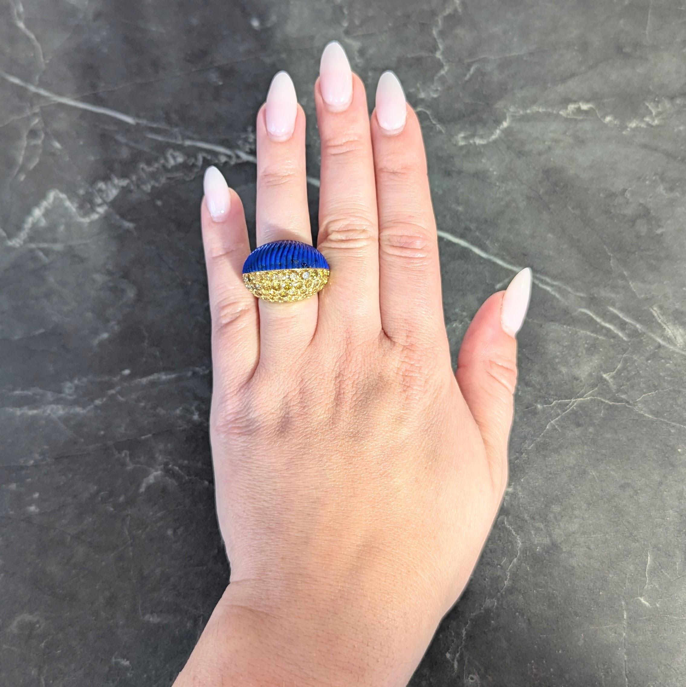 Designed as a slightly domed boule shaped form split with diamonds and lapis lazuli
Diamonds are round brilliant cut and weigh approximately 4.62 carats total
Fancy vivid yellow in color with VS clarity - pavé set throughout one half
Lapis lazuli