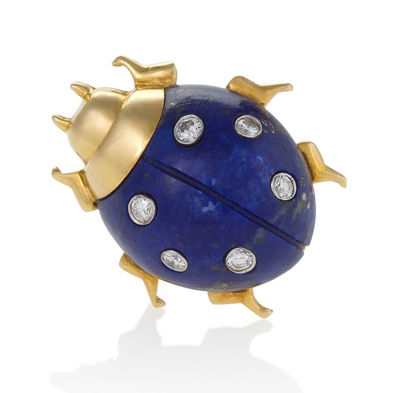 These charming lapis lazuli ladybug gold brooches with delightful diamond spots were a Cartier classic, first introduced in the late 1930s by Jeanne Toussaint, the Creative Director who led the return of the major French houses to themes of