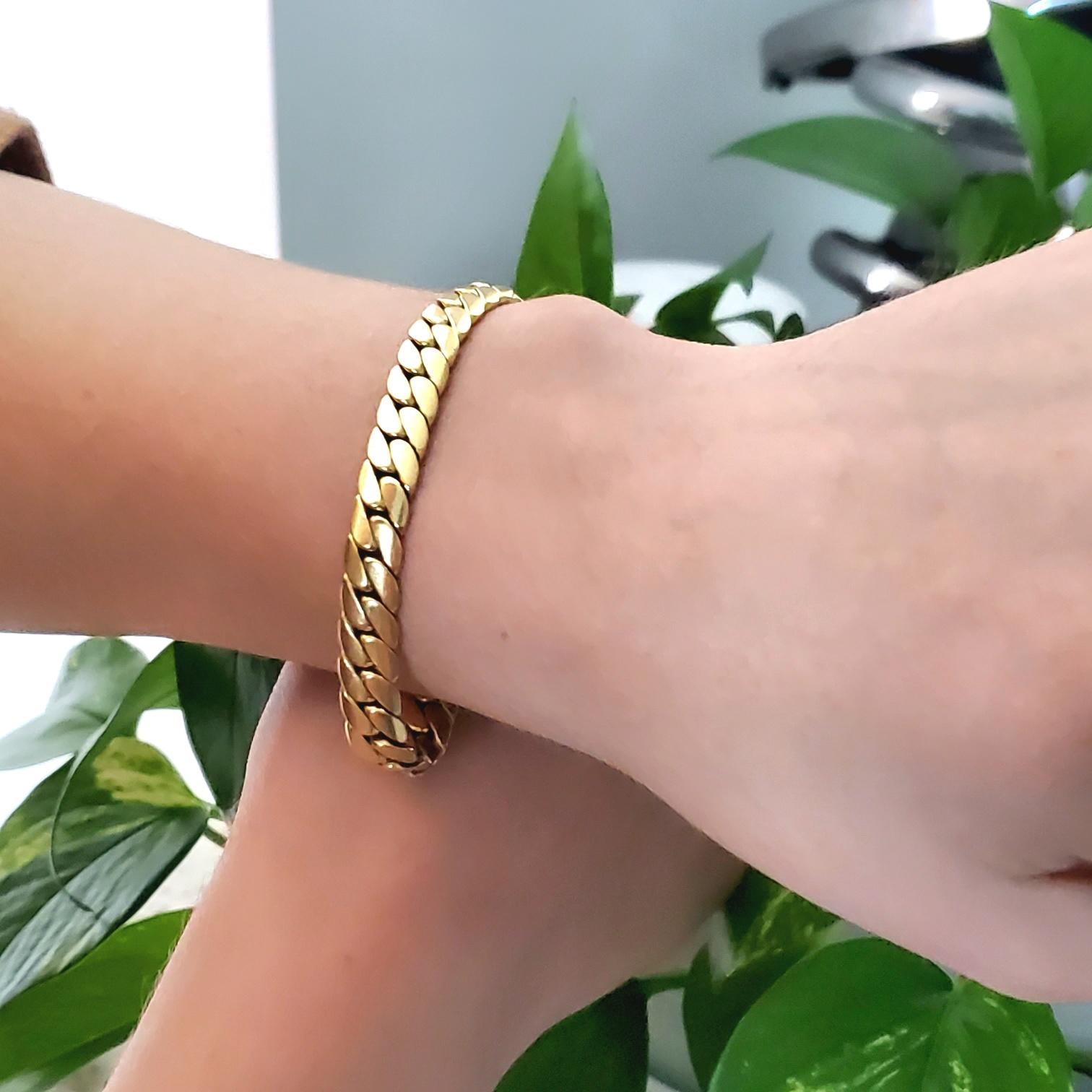 A bracelet designed by Cartier.

Beautiful, sleek and elegant bracelet, created in Paris France by the jewelry house of Cartier, back in the 1970's. This piece is very high in fashion and has been crafted with flat curb links in solid yellow gold of