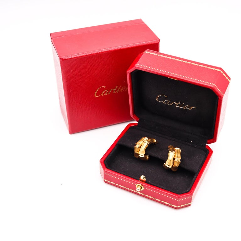 Double bamboo hoop earrings designed by Cartier.

Beautiful vintage pair, created in Paris France by the iconic jewelry house of Cartier, back in the late 1970's. These very chic classic pair of earrings, has been carefully crafted with the Bamboo
