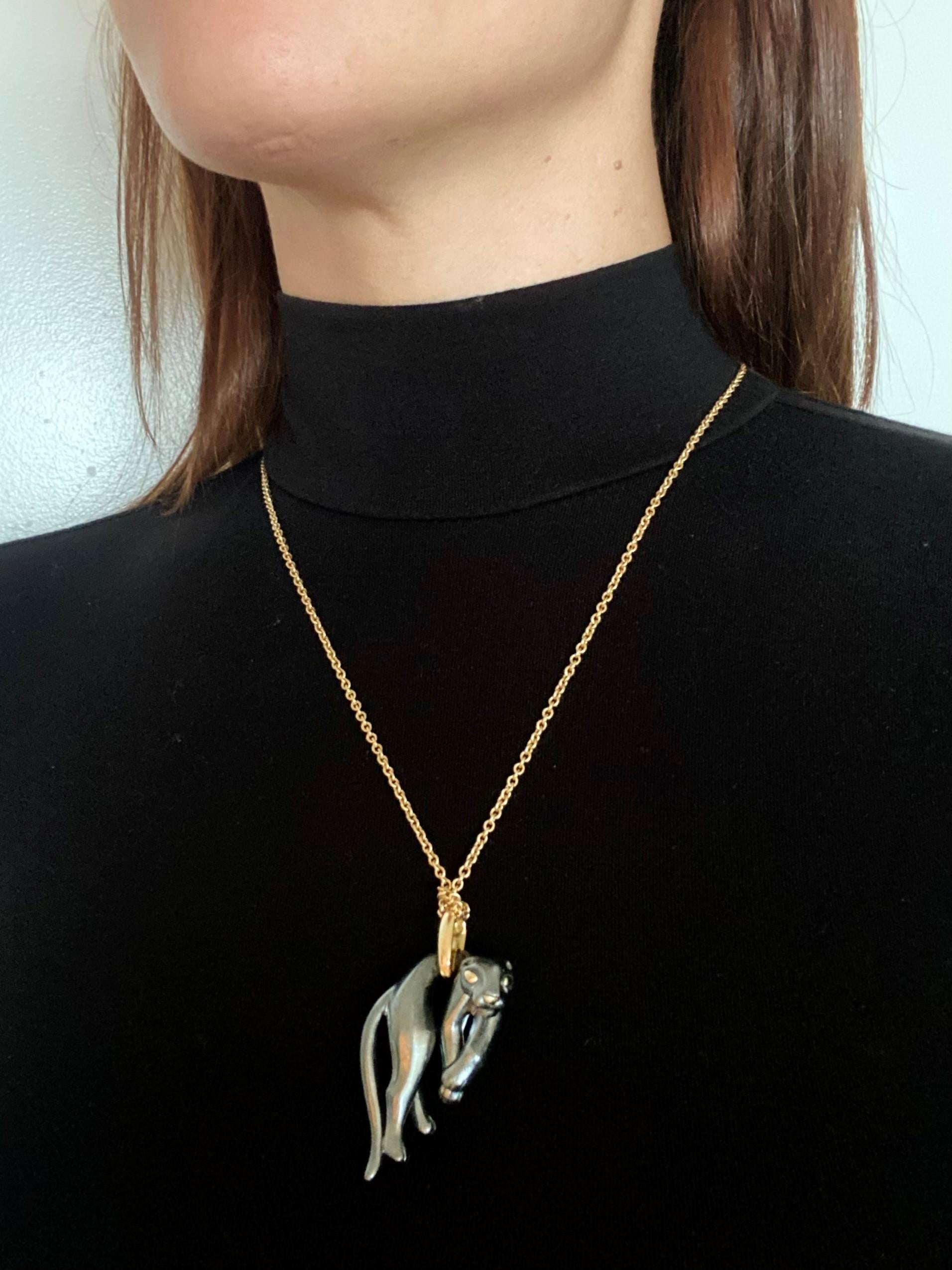 Panthere necklace chain designed by Cartier.

An iconic piece, created in Paris France by the jewelry house of Cartier, back in the 1970-1980. The design feature the stylized Panther Animal, hanging from the body to the right with the eyes and the