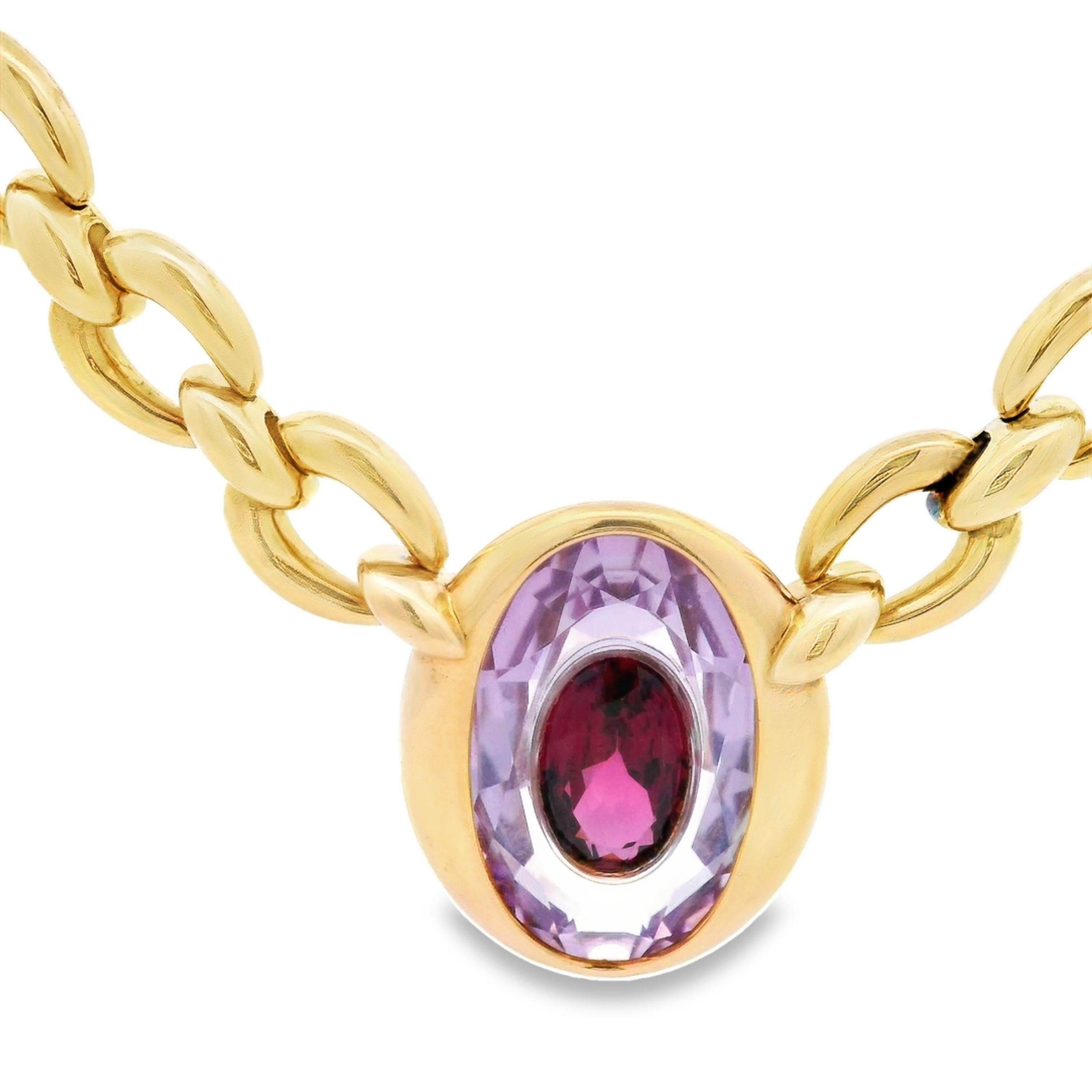 Cartier Paris Amethyst Garnet Invisible Set Pendant Necklace in 18K Yellow Gold 

This stunning Cartier Paris necklace features an 18 karat gold chain with a pendant that showcases an exquisite amethyst with a garnet INSIDE the amethyst. The