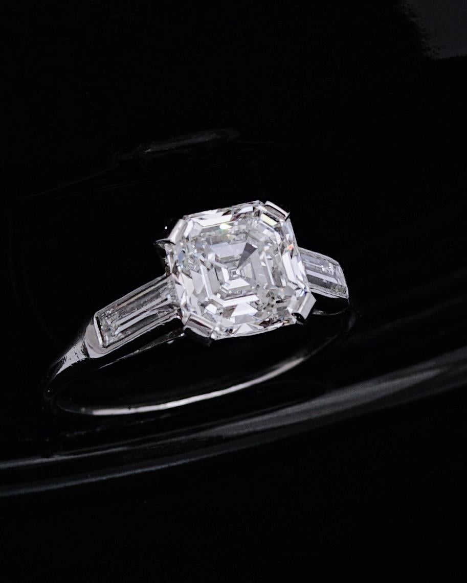 Cartier Paris, Asscher Cut Diamond RIng, Circa 1920
This GIA certified Asscher Cut Diamond. of 1,83 Carat, G Color and VVS2 Clarity, was beautifully mounted by Cartier Paris during the 1920's. 
Mounted in Platinum and set with two baguettes diamonds