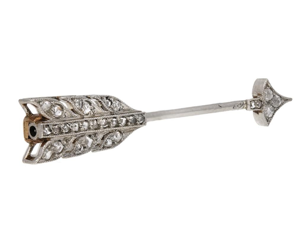 Antique rose diamond set jabot pin by Cartier Paris. Arrow set with twenty-eight rose cut diamonds, stones set to fletching and head, with an approximate total weight of 0.30 carats. Yellow gold case to verso, numbered and signed. Mounted and set in