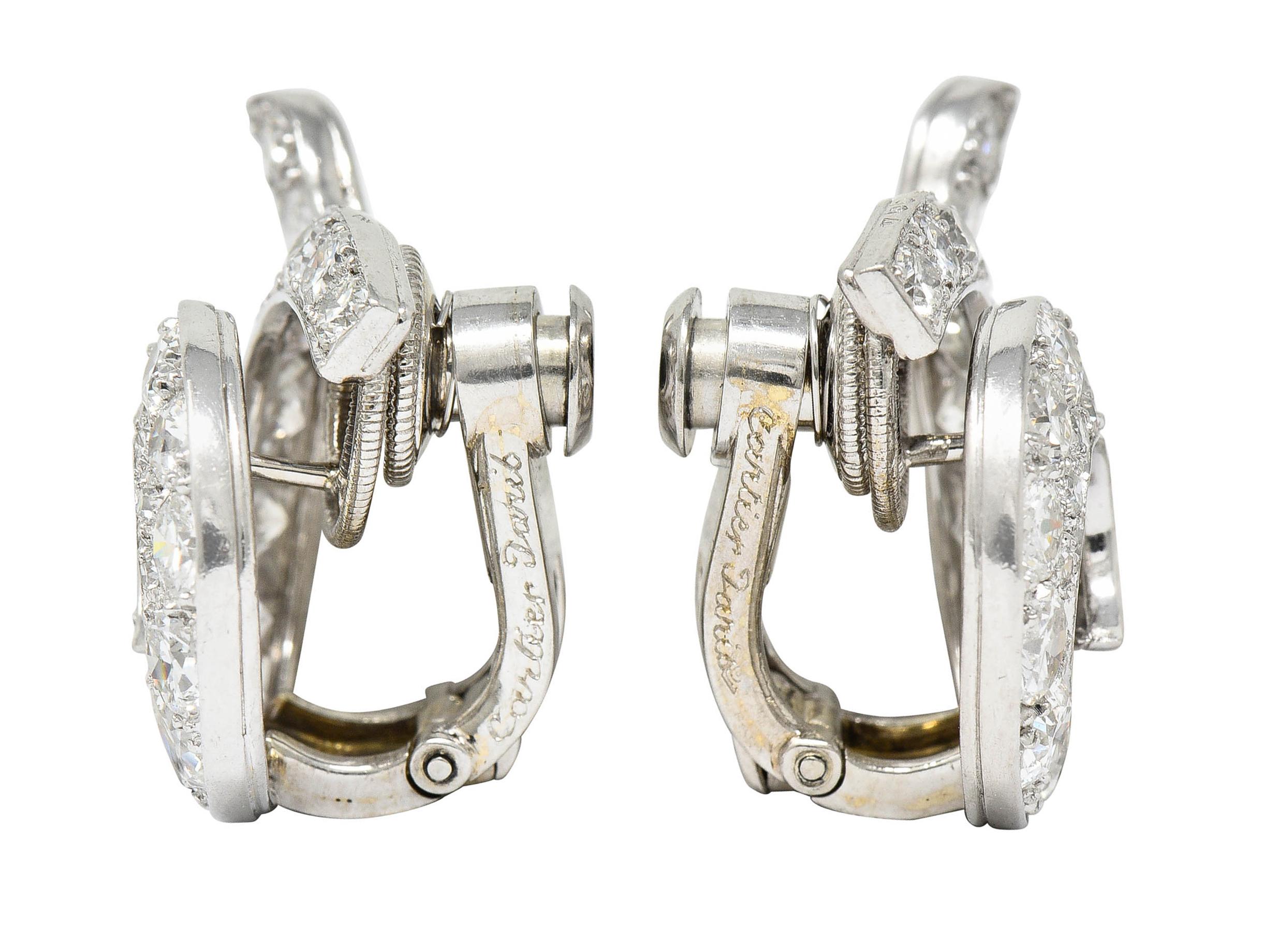 Ear-clips are designed as a spiraled swirl - dynamically formed

Bead set throughout by old European and transitional cut diamonds - graduating in size

Weighing in total approximately 5.00 carats with F to H color and VS to SI clarity

Completed by