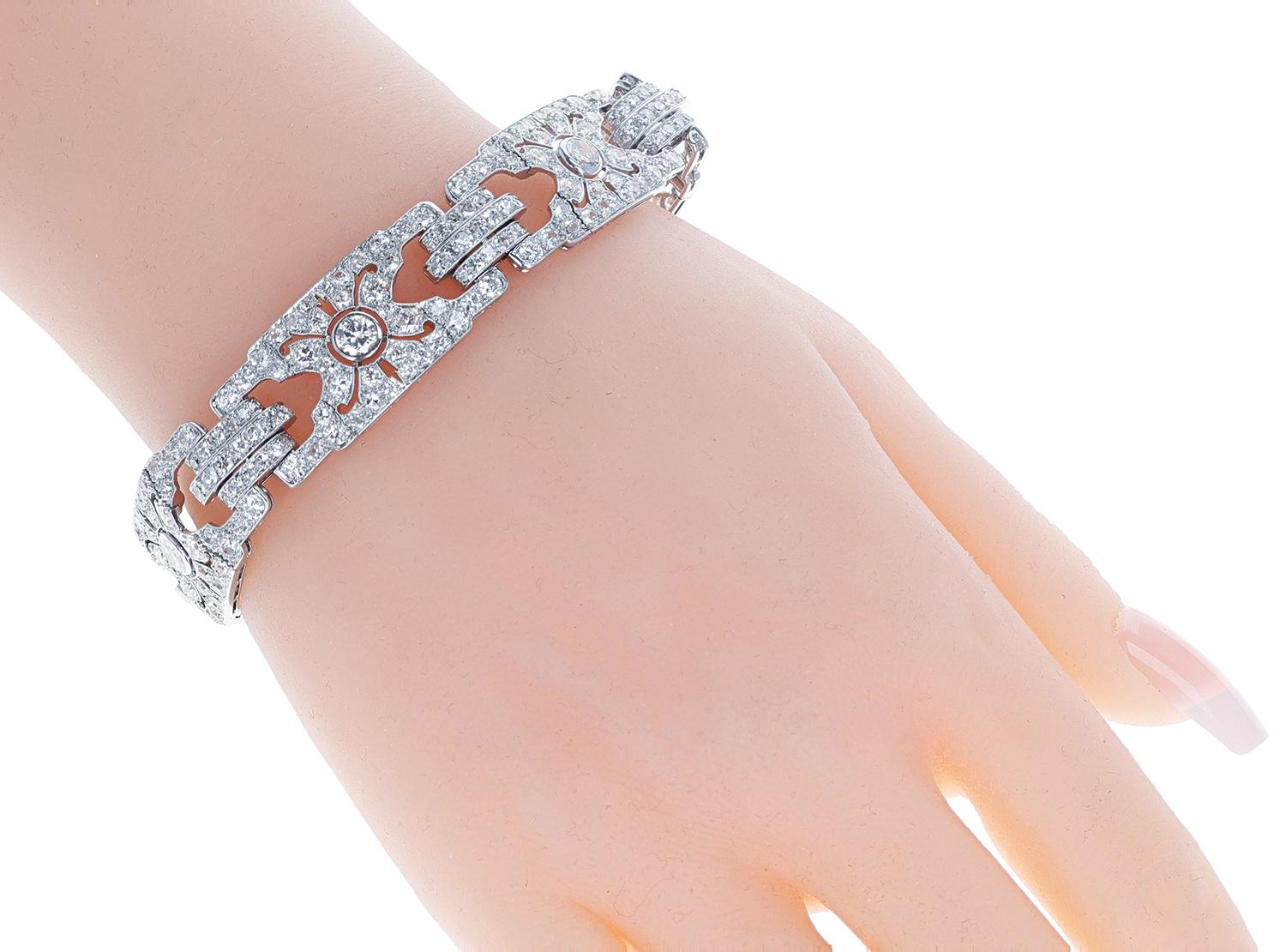 An Art Deco Cartier Paris Diamond Bracelet with French Marks Numbered and made in Platinum. The total diamond weight is appx. 20 carats. The total weight of the bracelet is 39.60 grams. The total length is 7 3/8 inches.
