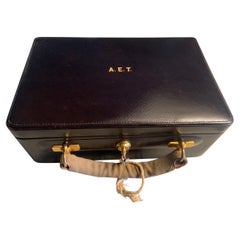 Cartier, Paris Black Leather and  Velvet Lined Jewelry Box and Key