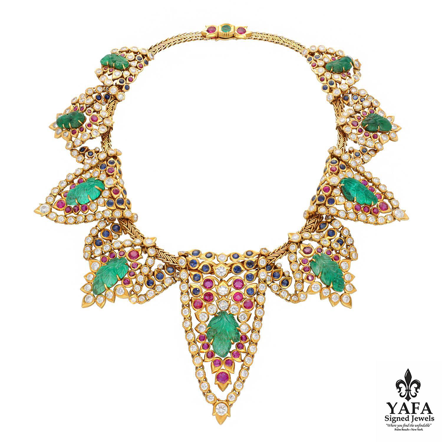Cartier Paris Carved Emerald, Ruby, Sapphire and Diamond Drapery Necklace & Ear Clips.
Of Mughal Inspiration the Flexible Motifs Centering on Carved Emeralds, Collet-Set with Rounds Diamonds as well as Round Rubies and Sapphires, on a Herringbone