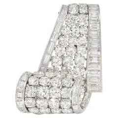 Cartier, Paris diamond and platinum graduated scroll brooch