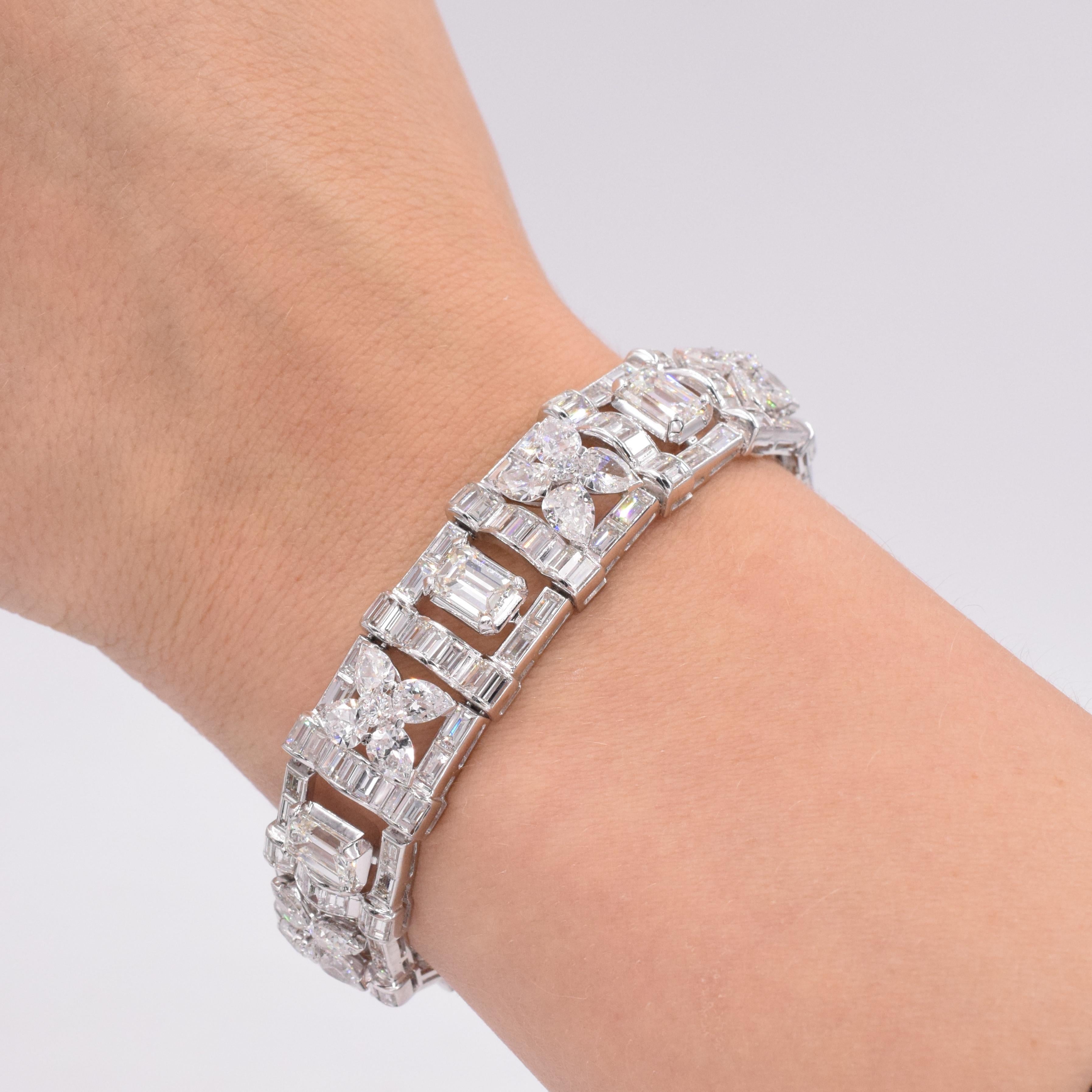 Impressive Cartier Diamond Bracelet circa 1960's
 with marquise, emerald and baguette shape diamonds with a total carat weight of approximately 30carats.  (Seven large Emerald cut diamonds, each one is 0.80-0.90 carat.)
Diamonds are Near Colorless