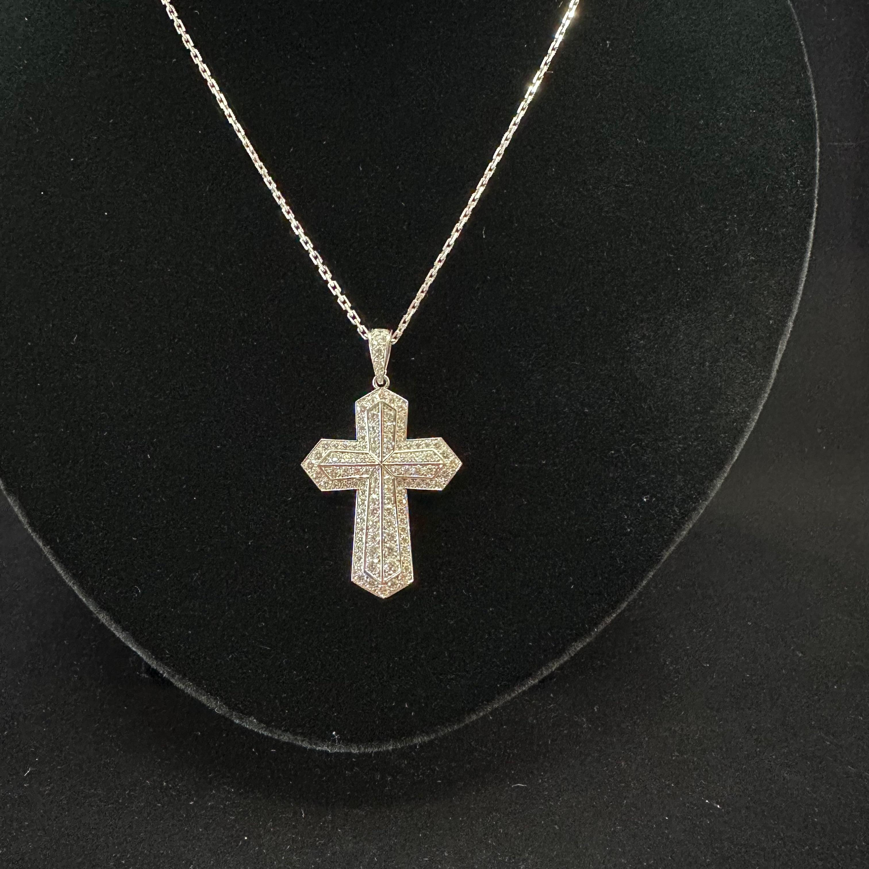 Cartier, Paris, Pave Diamond Cross
2 inches by 1 inch 
Est, 90 Diamonds 2.50 cts TW
French Hallmarks of the workshop and Cartier & numbers plus other stamps see pictures.
The Cross Can Be Removed from the  16.5 inch Chain.
Excellent Condition.


