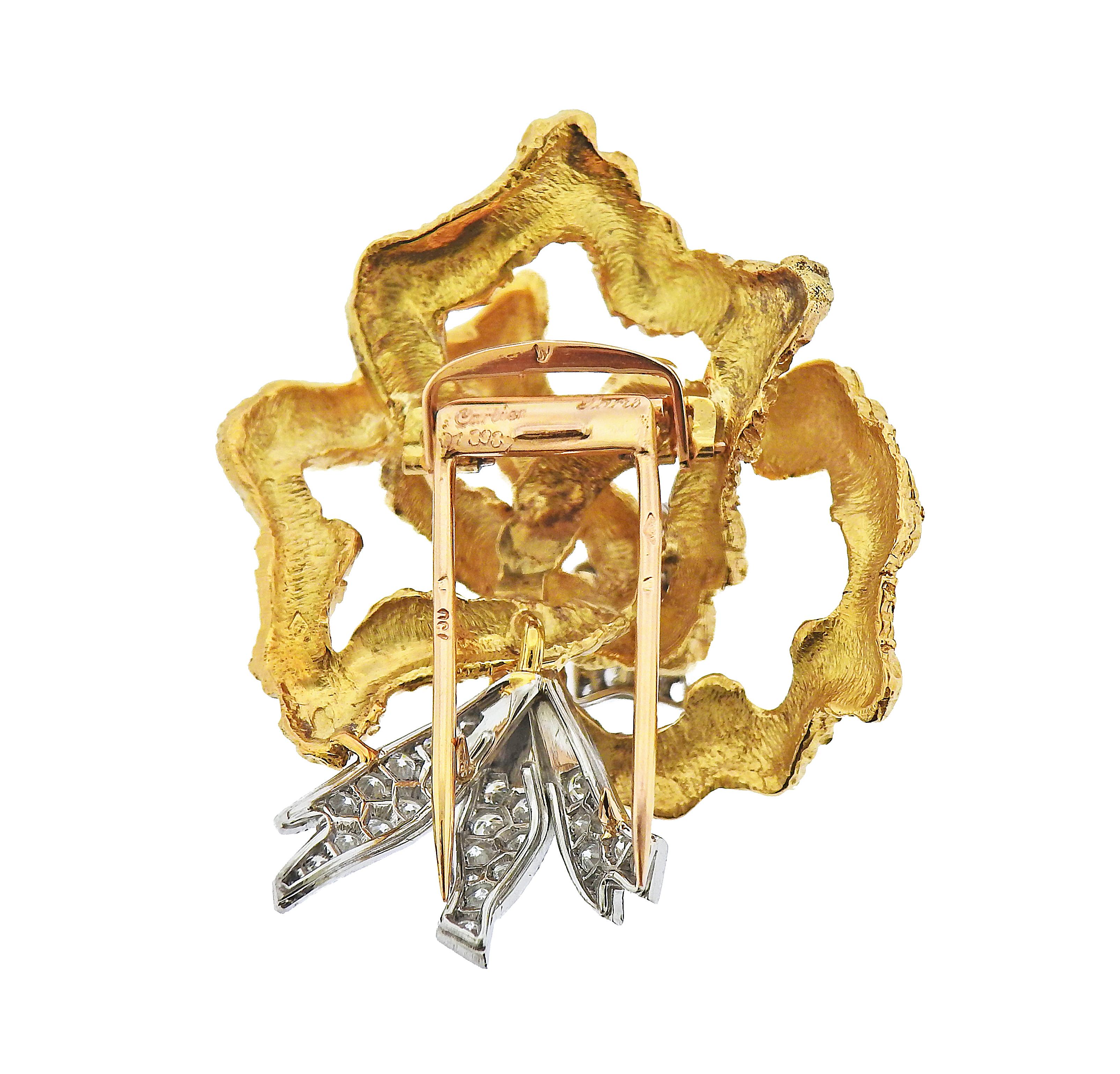 Cartier Paris 18k gold and platinum brooch, adorned with approx. 1.10ctw in diamonds. Brooch measures 43mm x 35mm. Marked: Cartier Paris, French marks on stem, 01 336. Weight - 21 grams.