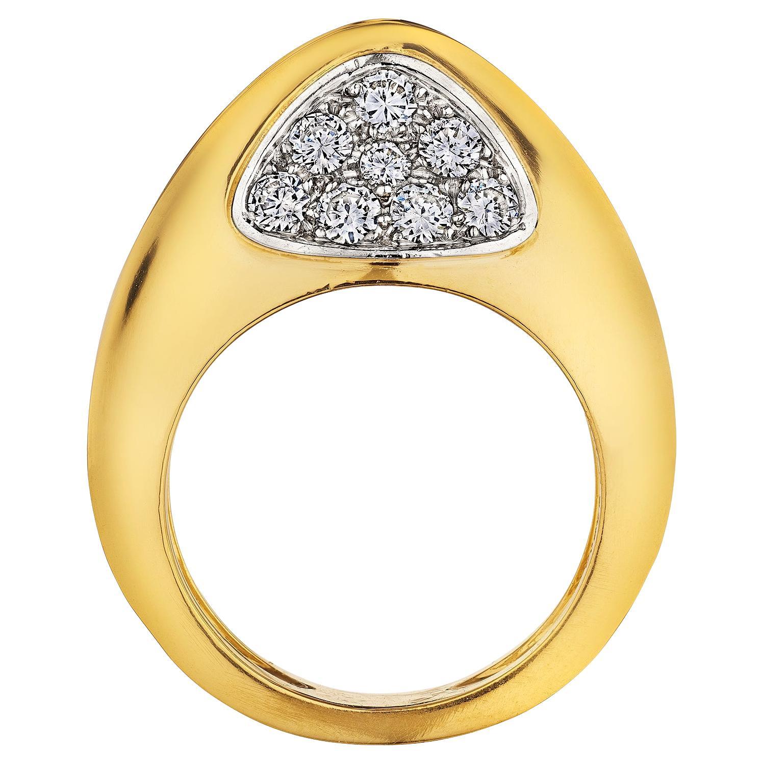 Filled with sass and sizzle, this strikingly unique Cartier Paris diamond and gold domed vintage ring is visually exciting.  Signed Cartier with serial #34917.  Circa 1975.  Side diamond total weight is .75 carats.  18 karat yellow gold.    