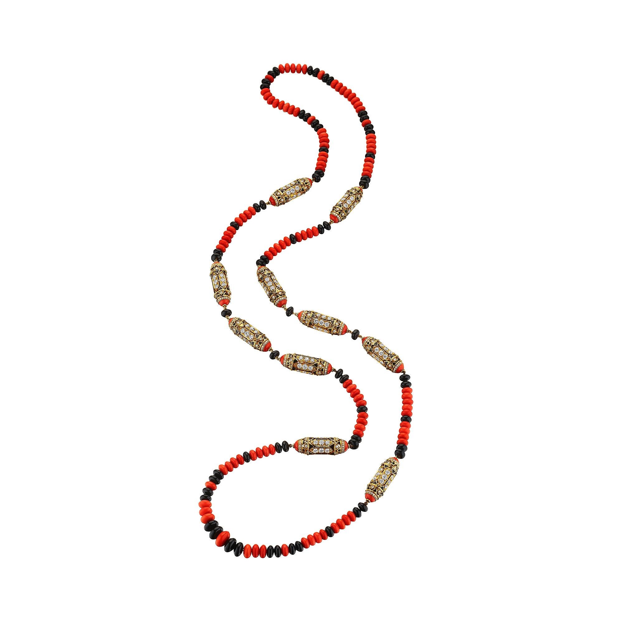 Inspired by the enchanted lands of the Far East, this incredible Cartier diamond gold onyx and coral bead necklace is pure magic.  The coral and black onyx beads are interspersed with diamond, gold, and black lacquer elements reminiscent of sacred