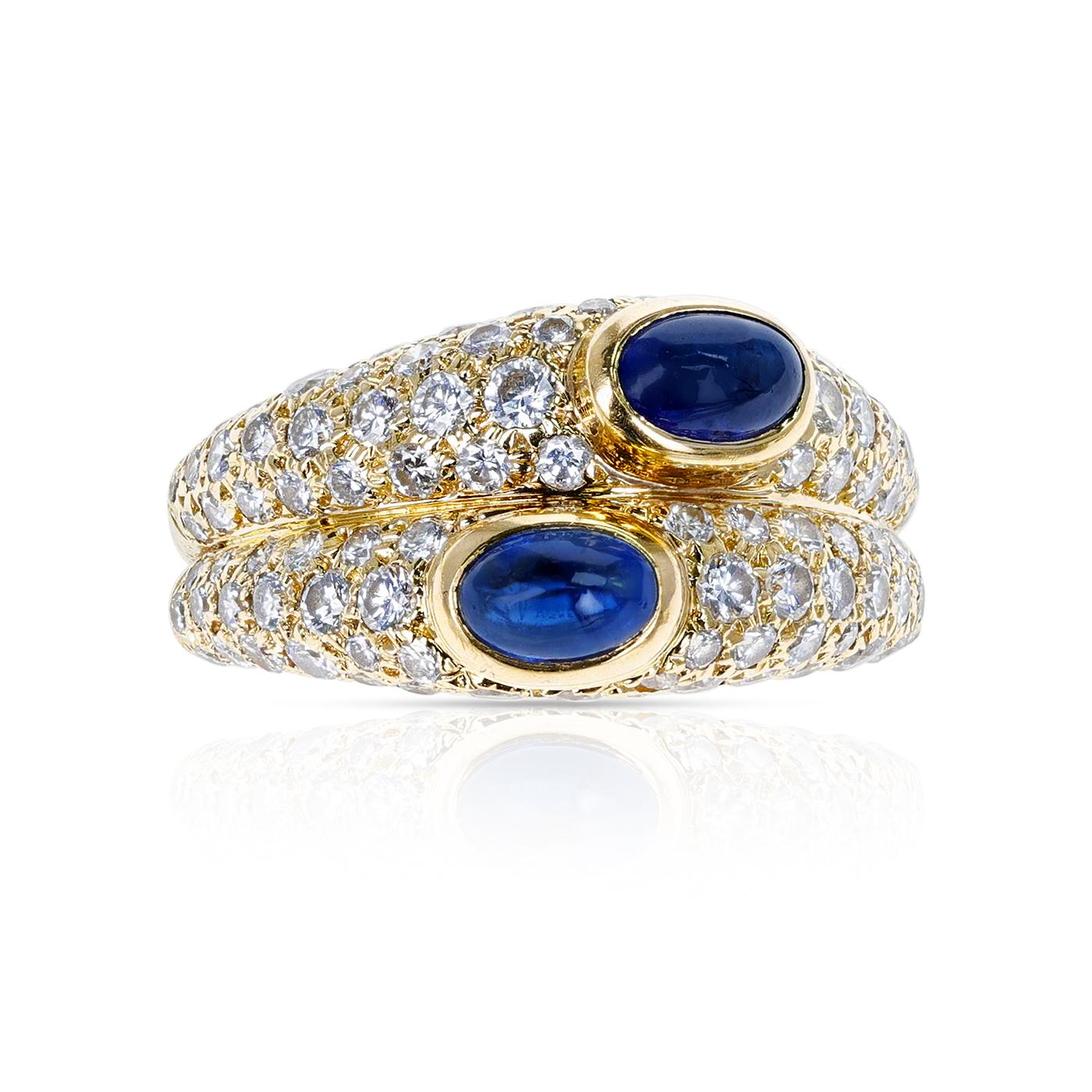 A Cartier Paris Double Sapphire Cabochon and Diamond Ring made in 18K Yellow Gold. Total Weight: 7.26 grams, Ring Size US 6.50.  
