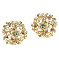 Cartier paris earrings in 18 kt yellow gold with diamonds , emerald and rubies.