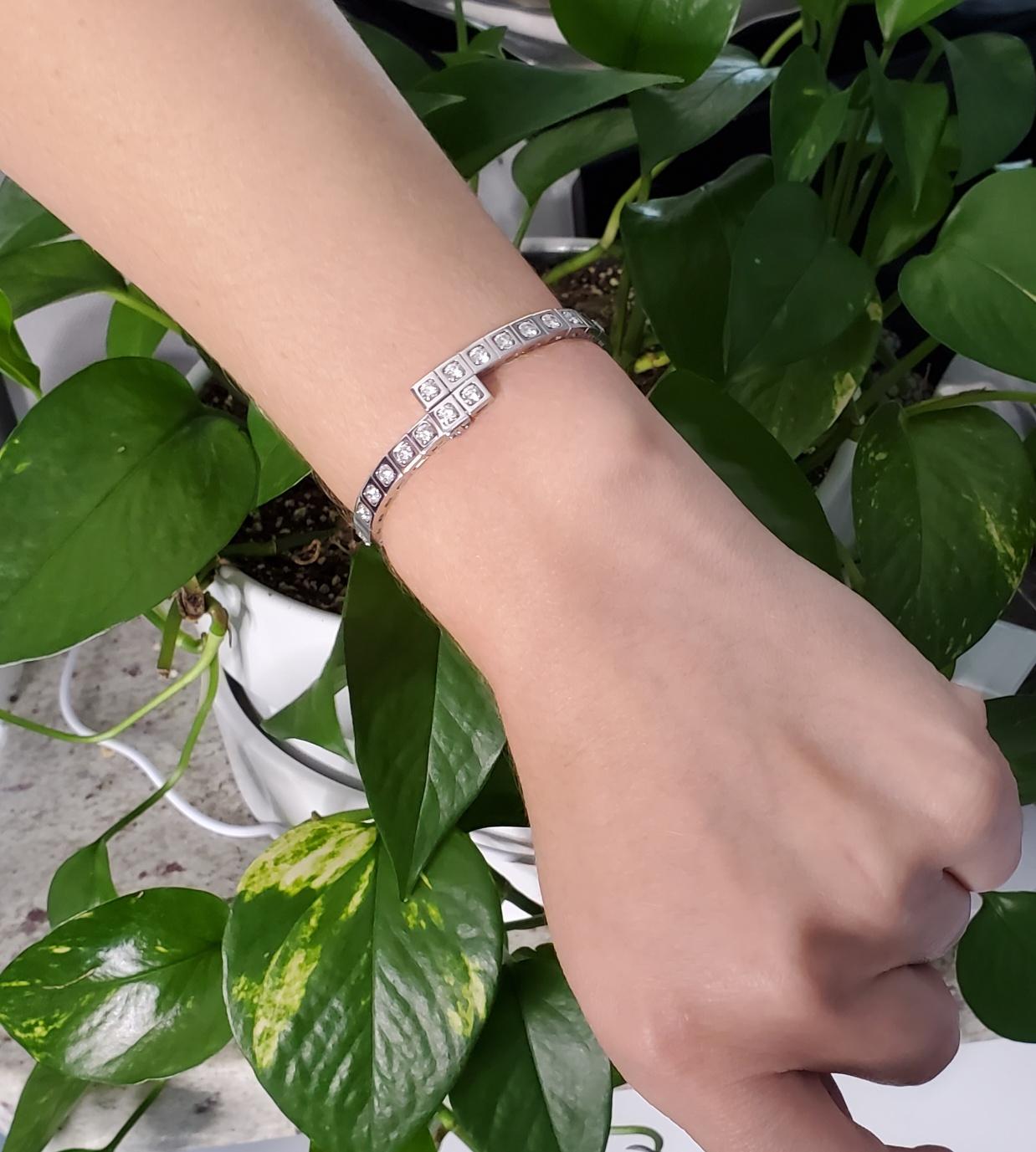 Gem set tectonique bracelet bangle designed by Cartier.

A rare contemporary 18 karats white gold diamond set Tectonique bangle bracelet created by the jewelry house of Cartier. This bracelet is comprised of square links, of which 21 are set with a