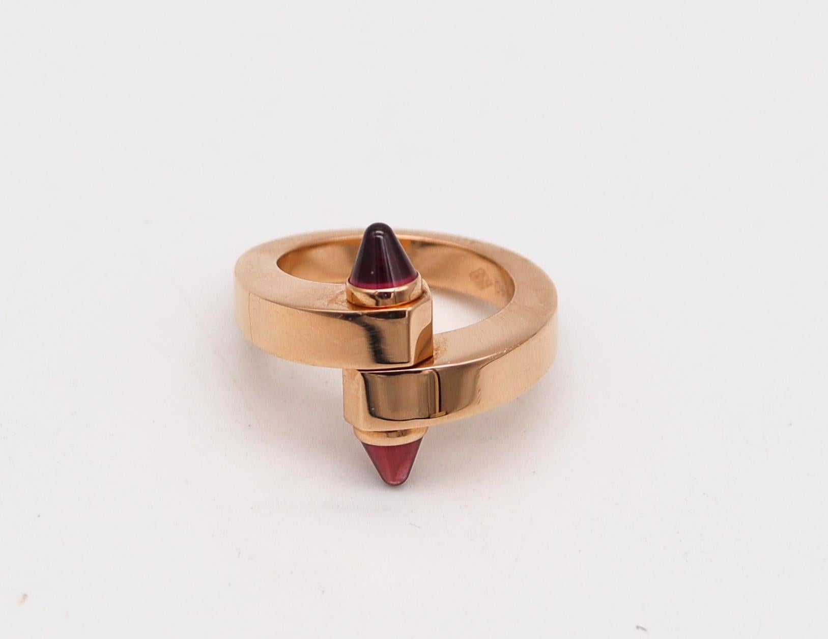 Menotte bypass ring designed by Cartier.

An statement Menotte ring, created in Paris France by the iconic jewelry house of Cartier. This iconic sculptural bypass ring has been crafted with industrial designs patterns in solid rose gold of 18 karats