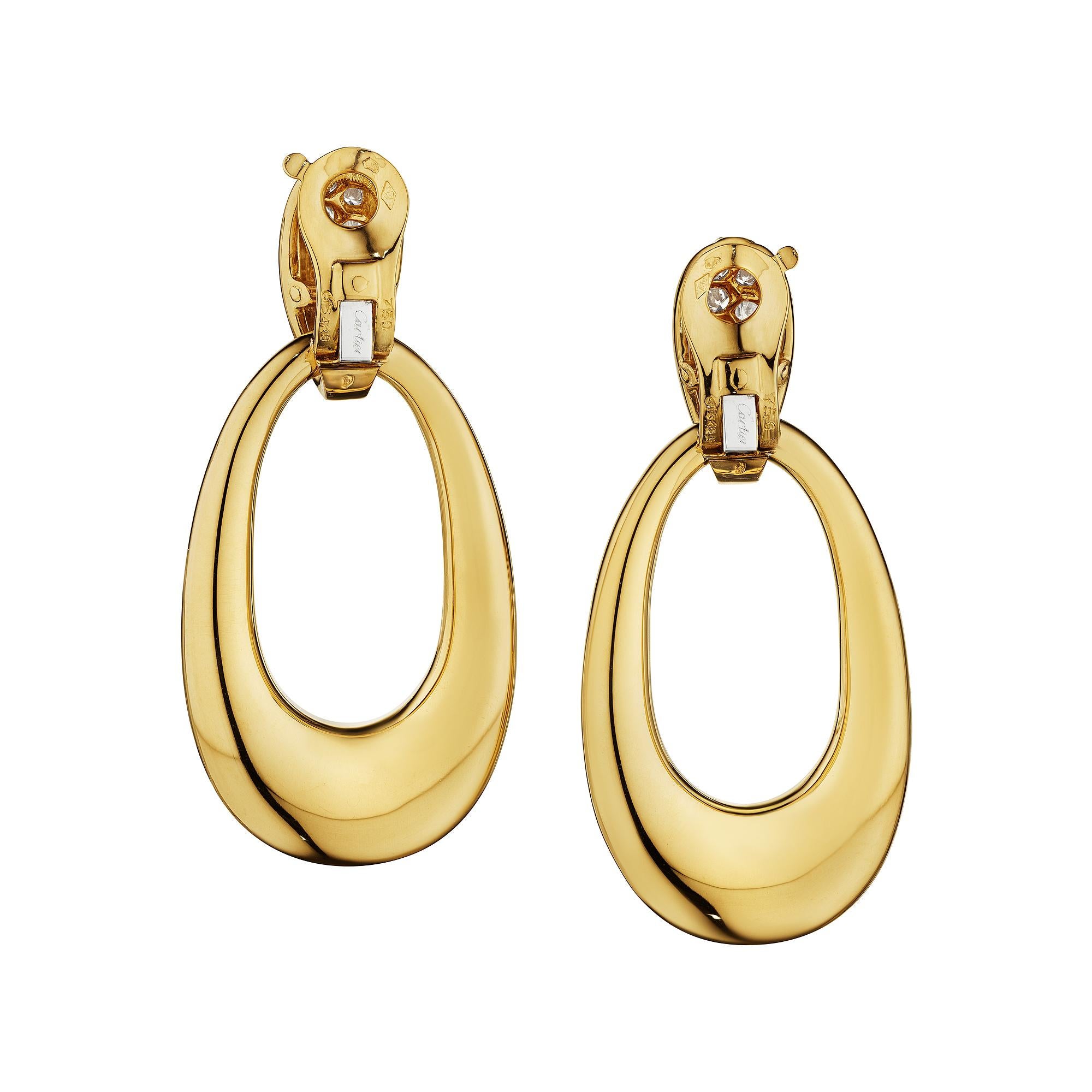 Knock knock who is there?  It is an exquisite pair of Cartier Paris Georges L'Enfant clip door knocker diamond yellow gold vintage earrings.  Sensuously swinging from small diamond top hoops, the 18 karat yellow gold large oval drop loops can be