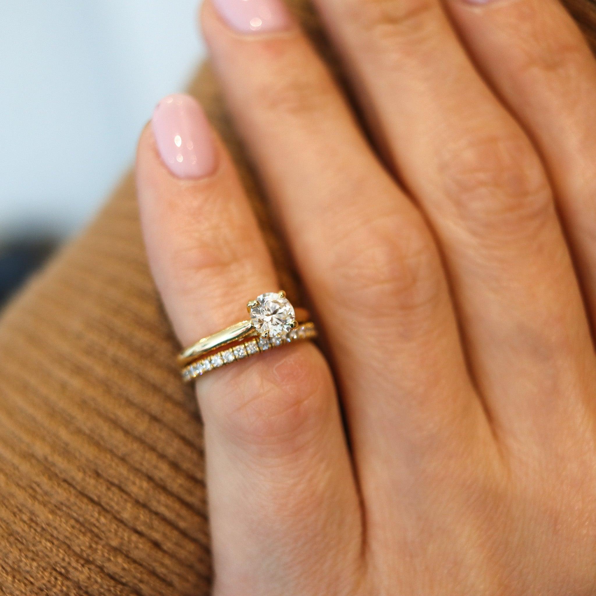 Solitaire & eternity rings set designed by Cartier.

This is a modern set of rings created in Paris France by the jewelry house of Cartier. This suite is composed by a solitaire ring and a eternity band crafted in solid yellow gold of 18 karats with