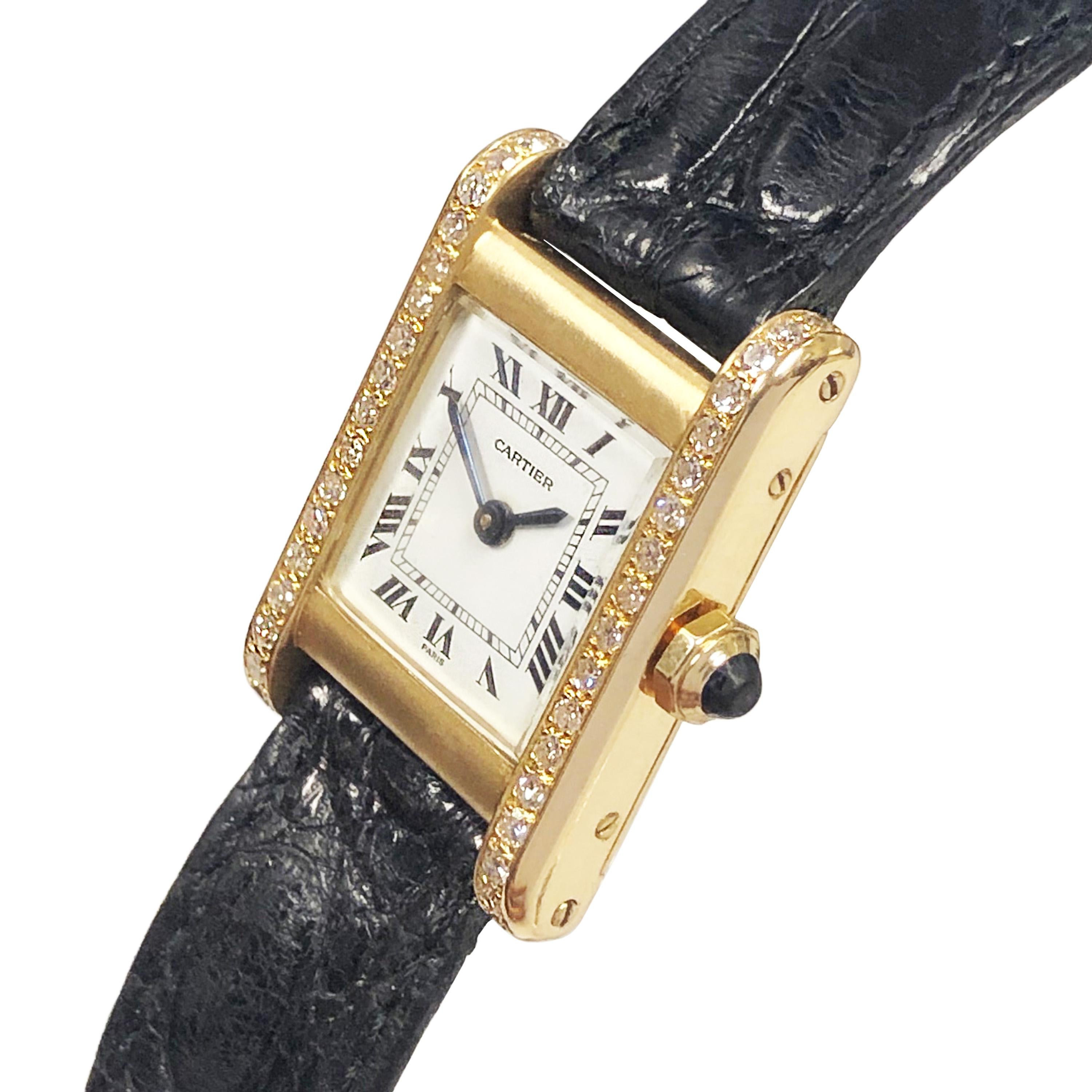 Circa 1970s Cartier Paris Ladies Tank Wrist Watch, 27 X 20 MM 18k Yellow Gold 2 piece case, 38 single cut Diamonds totaling 3/4 Carat. Sapphire crown. 17 jewel Mechanical, Manual wind movement. White Enamel Dial with Black Roman numerals. original