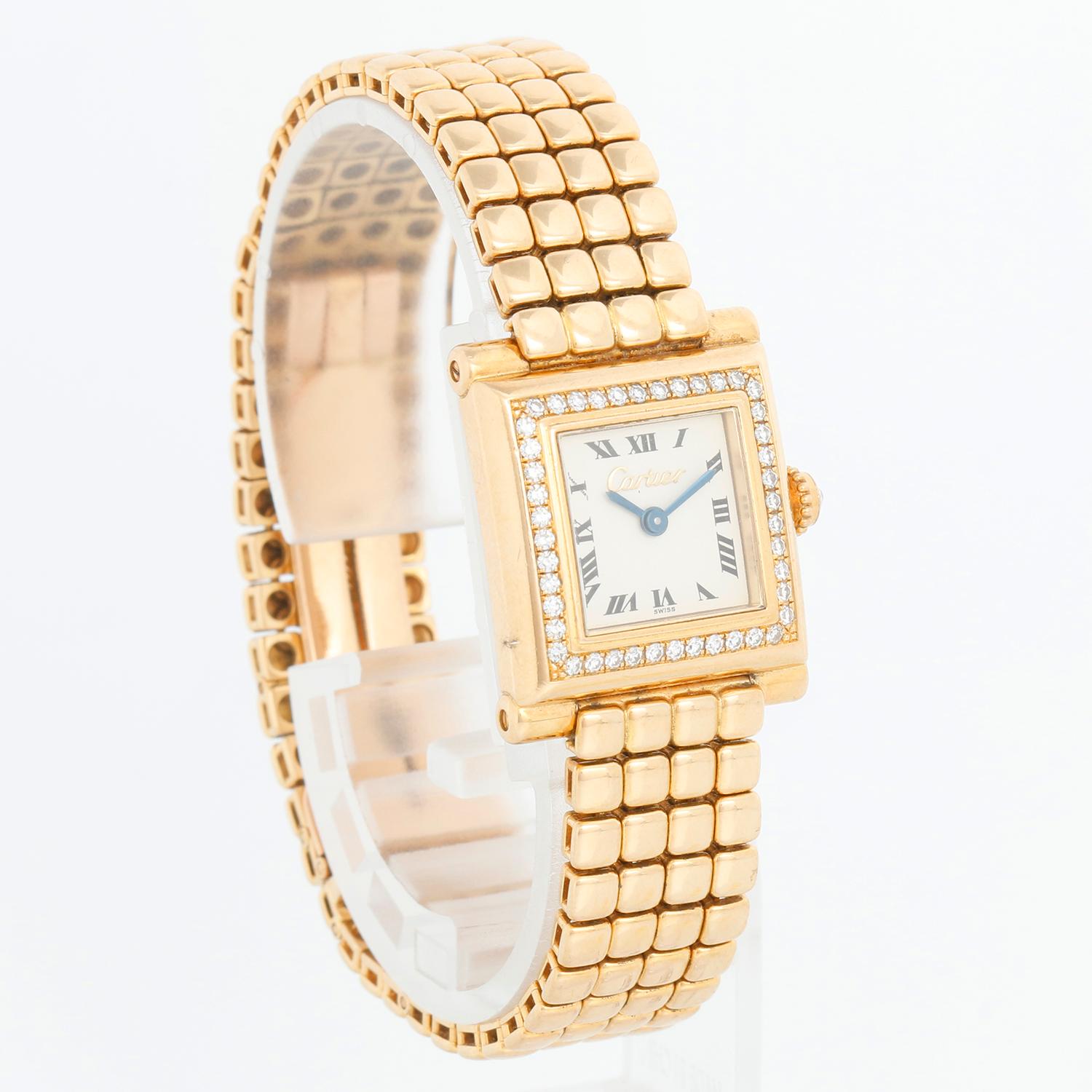 Cartier Paris Gold and Diamond 'Trocadero' Ladies Watch  - Quartz. 18K Yellow gold ( 20x 25 mm). White dial with black Roman numerals signed Cartier; single cut diamond set bezel. Diamond crown. Four row square link bracelet with deployant clasp;
