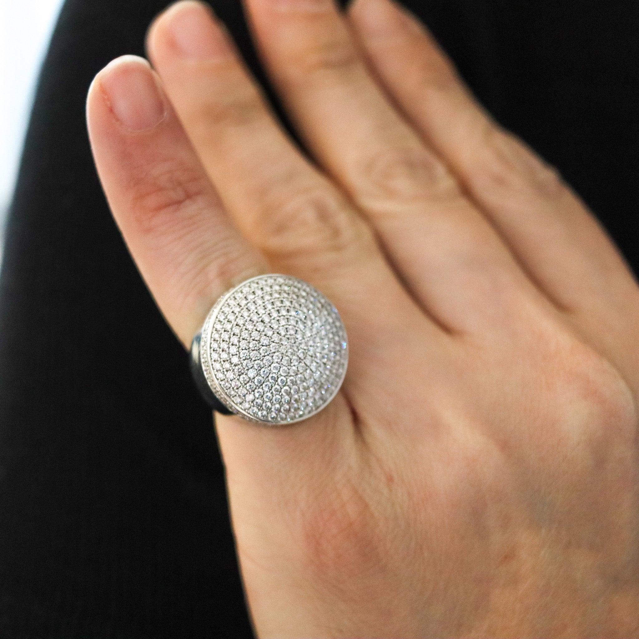 A Jeton Sauvage cocktail ring designed by Cartier.

This is a fantastic special-edition Jeton Sauvage cocktail ring, created in Paris France by the jewelry house of Cartier, back in the 1999-2000. The ring is designed with a geometric circular form