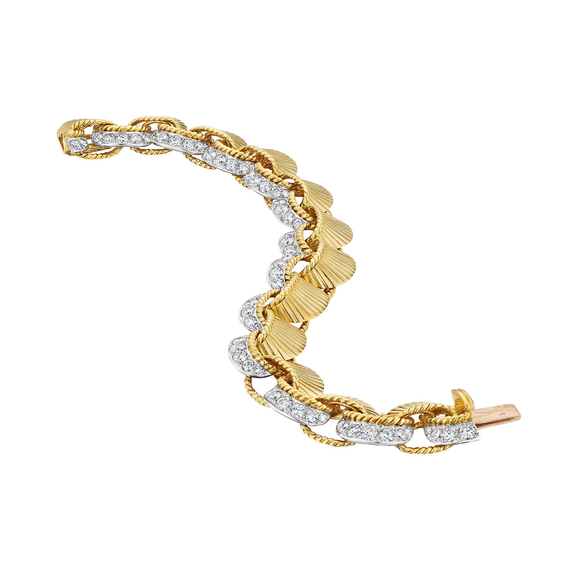 Tying ribbons around your wrist has traditionally symbolized good luck, protection, and great fortune, and this extraordinary Cartier Paris mid-century diamond, platinum, 18 karat yellow gold ribbon bracelet will have you covered.  With 12