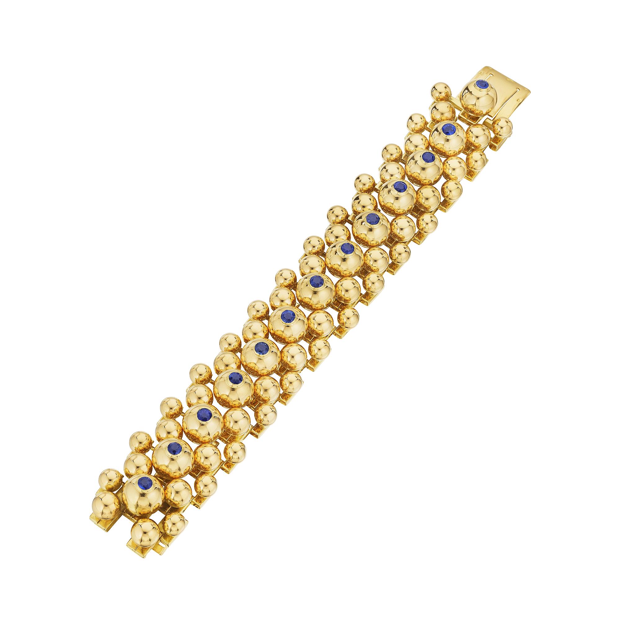 No one will ever dare to burst your bubble when wearing this rare Cartier Paris mid-century sapphire 18 karat yellow gold bracelet.  Varying sizes of gold spheres, with the largest being topped with vivid round brilliant cut sapphires, are cleverly