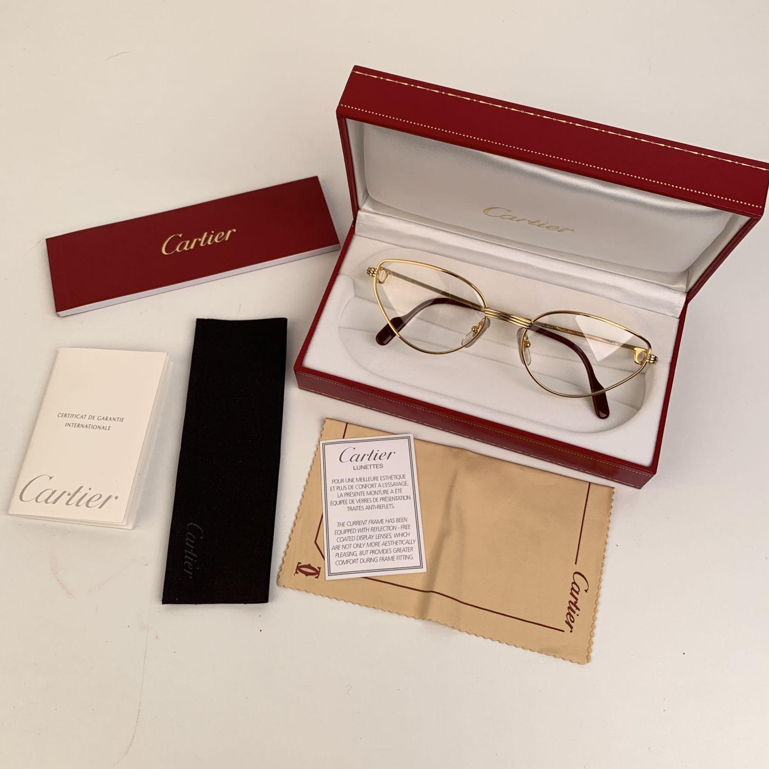 Original Vintage 1990s Cartier eyeglasses /frame from the 1990s. Beautiful gold cat-eye frame, with platinum finish on the sides.

Details

MATERIAL: Metal

COLOR: Gold

MODEL: Rivoli

GENDER: Women

COUNTRY OF MANUFACTURE: France

TYPE: