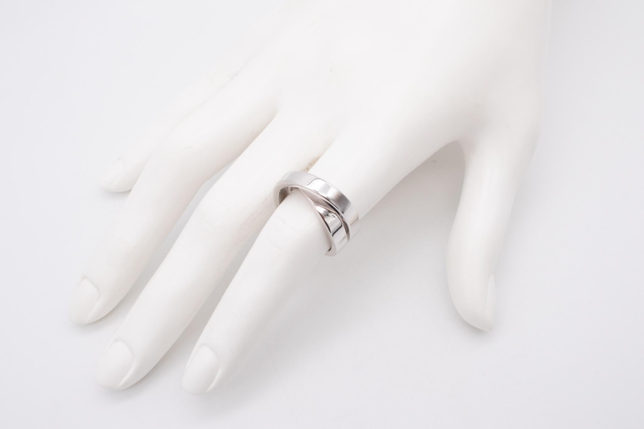 Great Nouvelle vague crossover ring designed by Cartier.

This piece is one of the most popular iconic designs from the house of Cartier of the 21th century. It was crafted in solid 18 karats of very high polished white gold.

Have total weight of