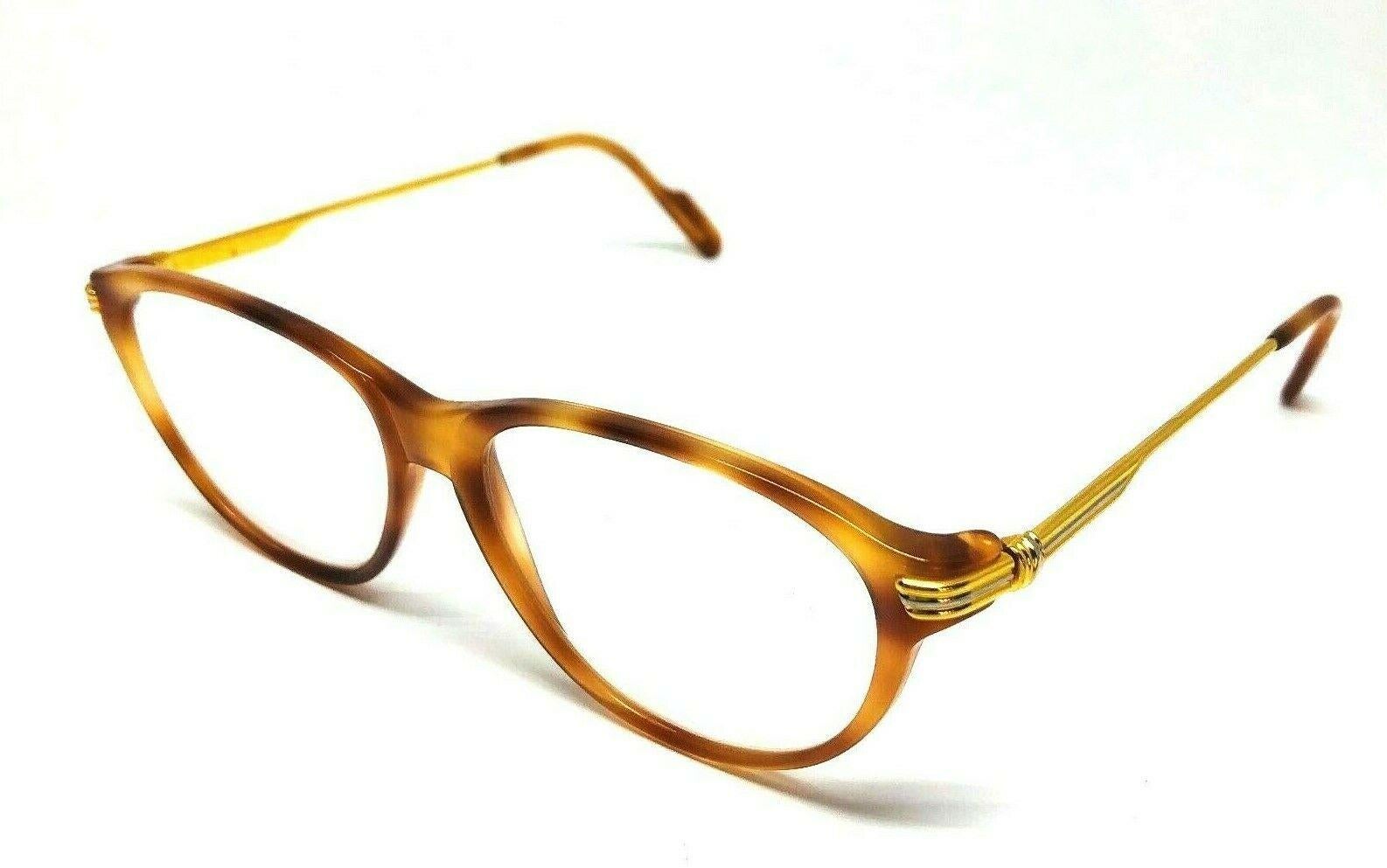 CARTIER Must De Lunettes Eyewear Glasses w/ Original Box Paris

Color: Light brown, signature yellow and white gold details on the sides

Measurements: 5.25”W x 1.75”H

Details: The eyewear is signed by Cartier Paris; it is stamped with the serial #