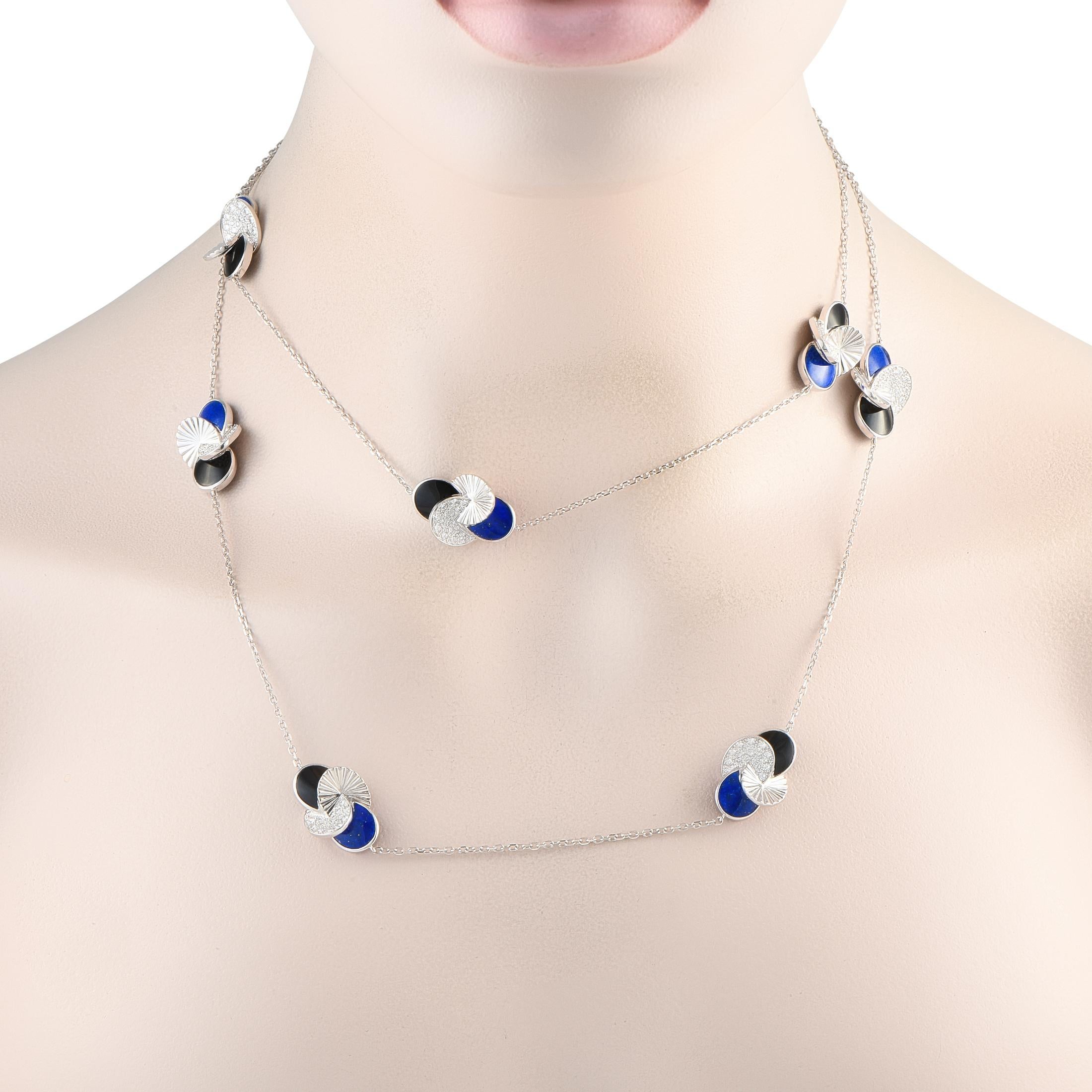 A long necklace destined to be a much-loved favorite. This Cartier Paris Nouvelle necklace measures 36 inches long and weighs 52.6 grams. Its white gold chain is adorned at evenly spaced stations with patterns of interlocking discs. Each motif
