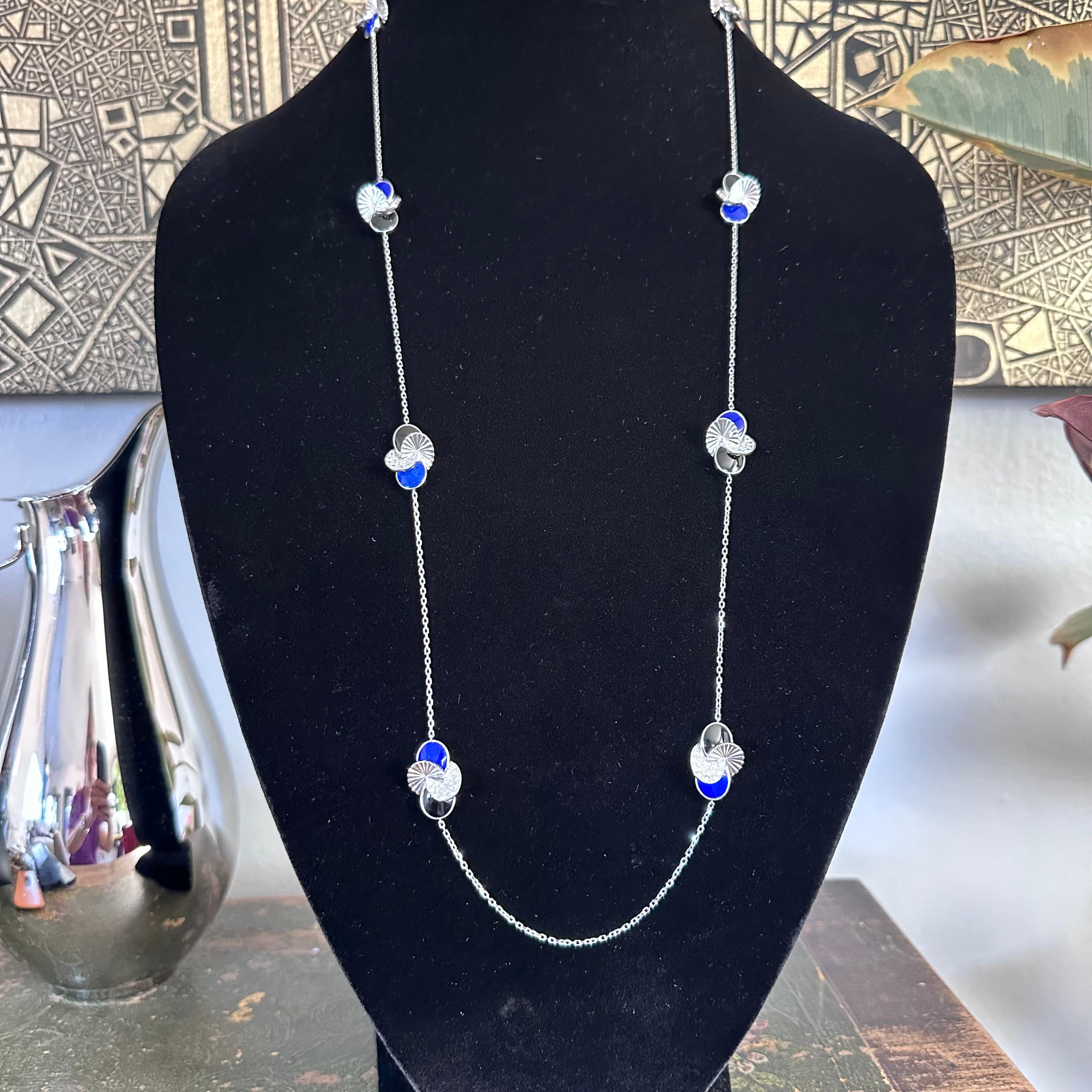 Cartier, Paris Nouvelle Collection Long White Gold Lapis Lazuli, Onyx and Diamonds 37 inch Necklace with eight stations of diamond, blue lapis and onyx. Stunning Pave set Diamonds, approximately 3 cts of Fine White D - E Color VVS Diamonds